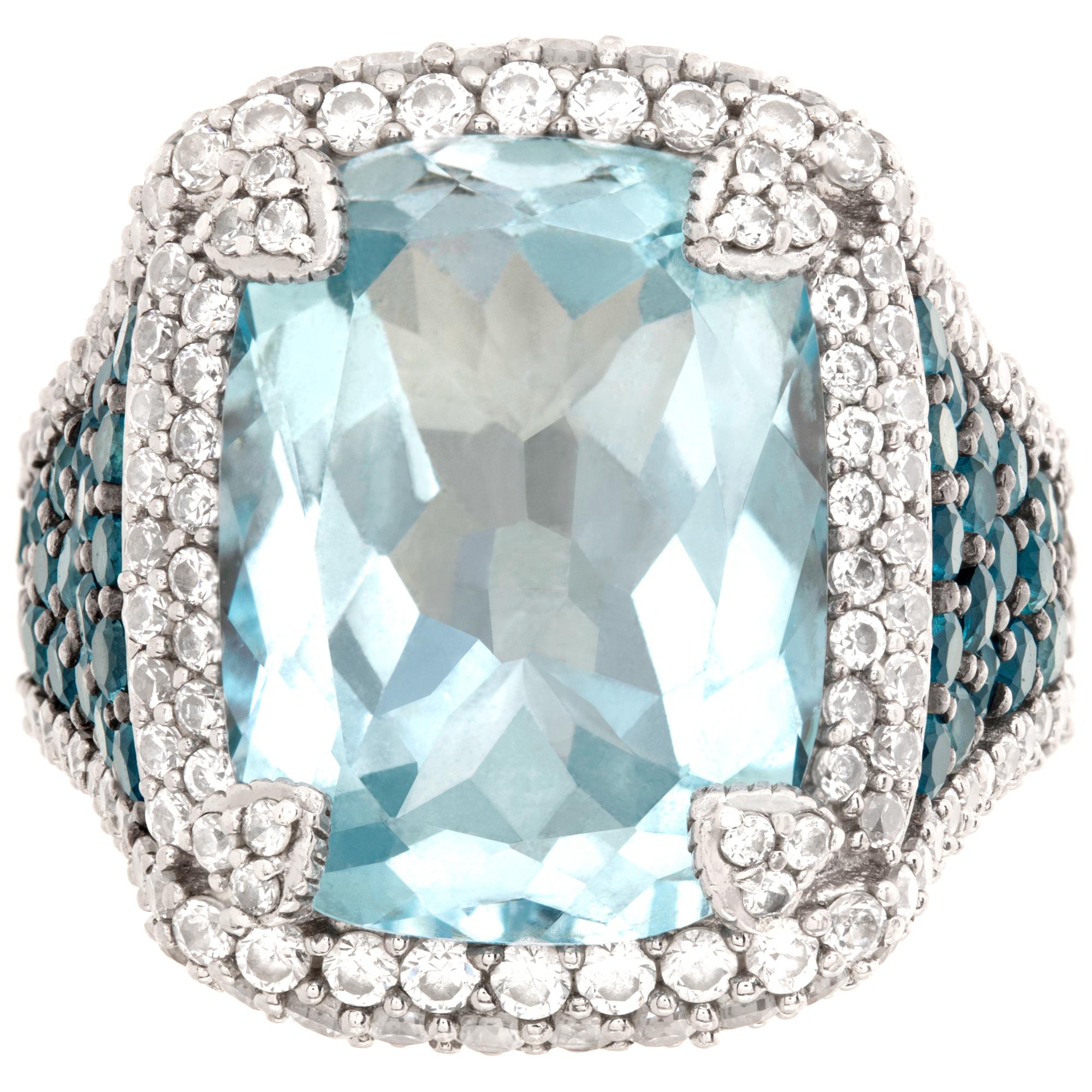 Judith Ripka ring with faceted blue topaz and white cubic zirconia in sterling silver. Size 7, head measures 16mm x 20mm, shank 4mm thick.This Judith Ripka ring is currently size 7 and some items can be sized up or down, please ask! It weighs 9.3