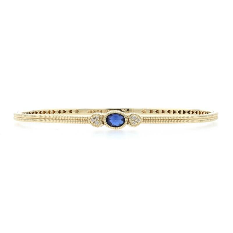 Brand: Judith Ripka

Metal Content: 14k Yellow Gold

Stone Information
Genuine Sapphire
Treatment: Heating
Carat: .85ct
Cut: Oval Rose Cut Cabochon
Color: Blue

Natural Diamonds
Carats: .06ctw
Cut: Round Brilliant
Color: F - G
Clarity: VS1 -