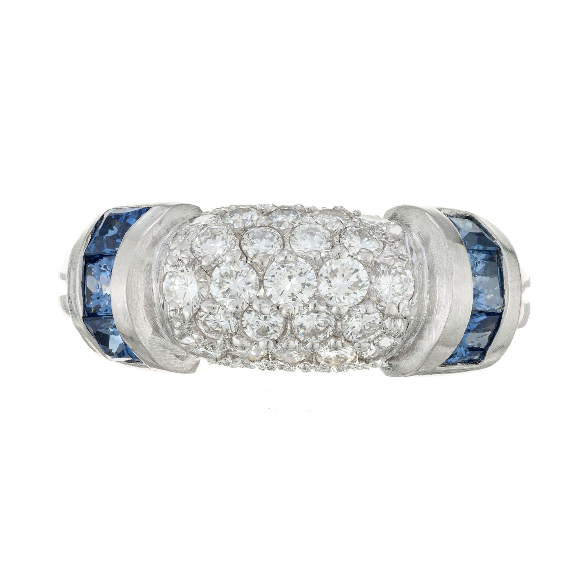 Authentic Judith Ripka sapphire an diamond 18k white gold dome ring.  The center is bead set with 23 Ideal full cut round diamonds with channel set square cut Ceylon sapphires. The signature has been partially altered due to sizing. A few of the