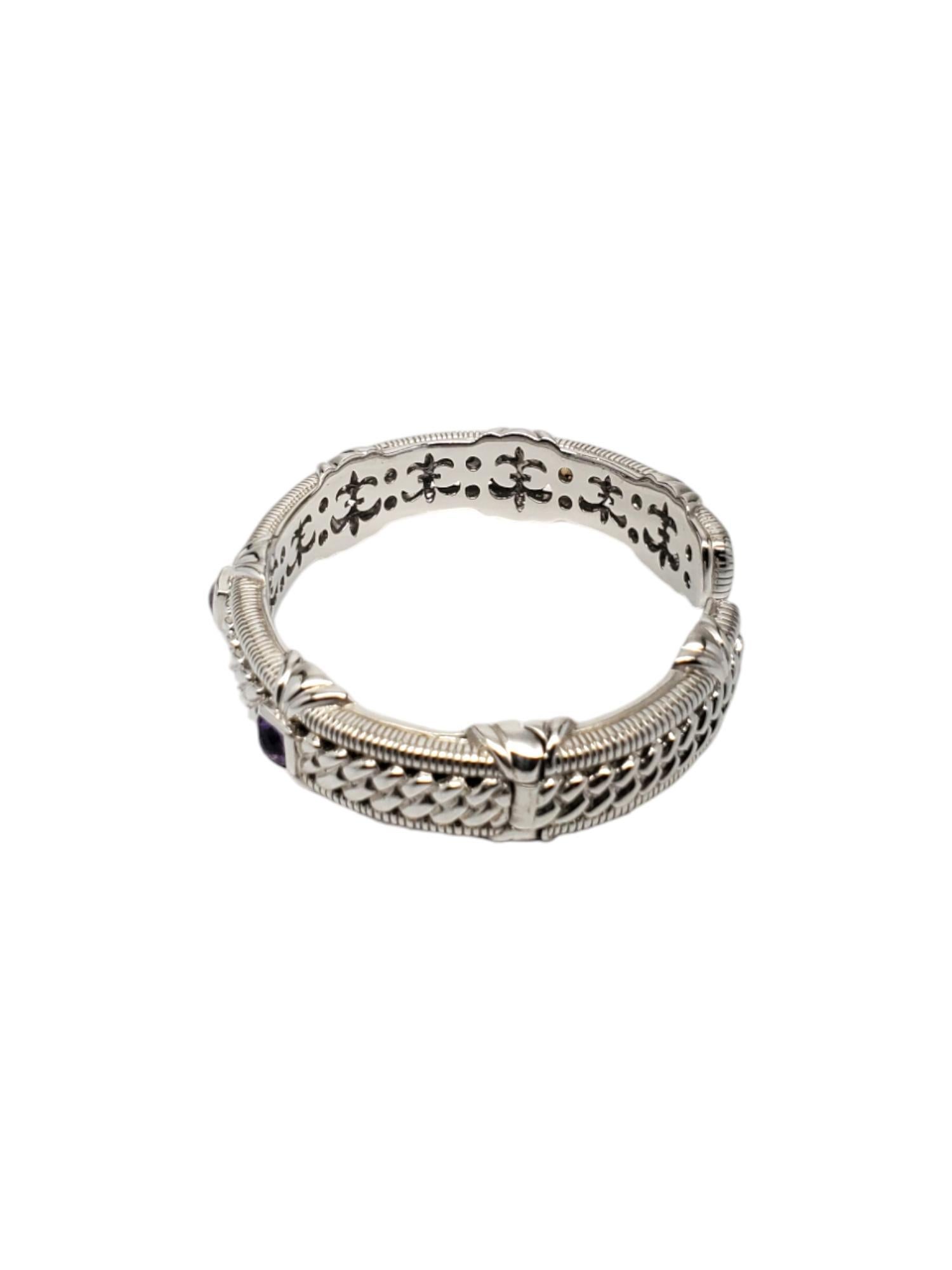 Judith Ripka Sterling Silver Amethyst Hinged Cuff Bracelet-

This elegant hinged cuff bracelet by Judith Ripka features 3 square amethyst gemstones and is set in a sterling silver cable design.

Size: Fits up to 6.75