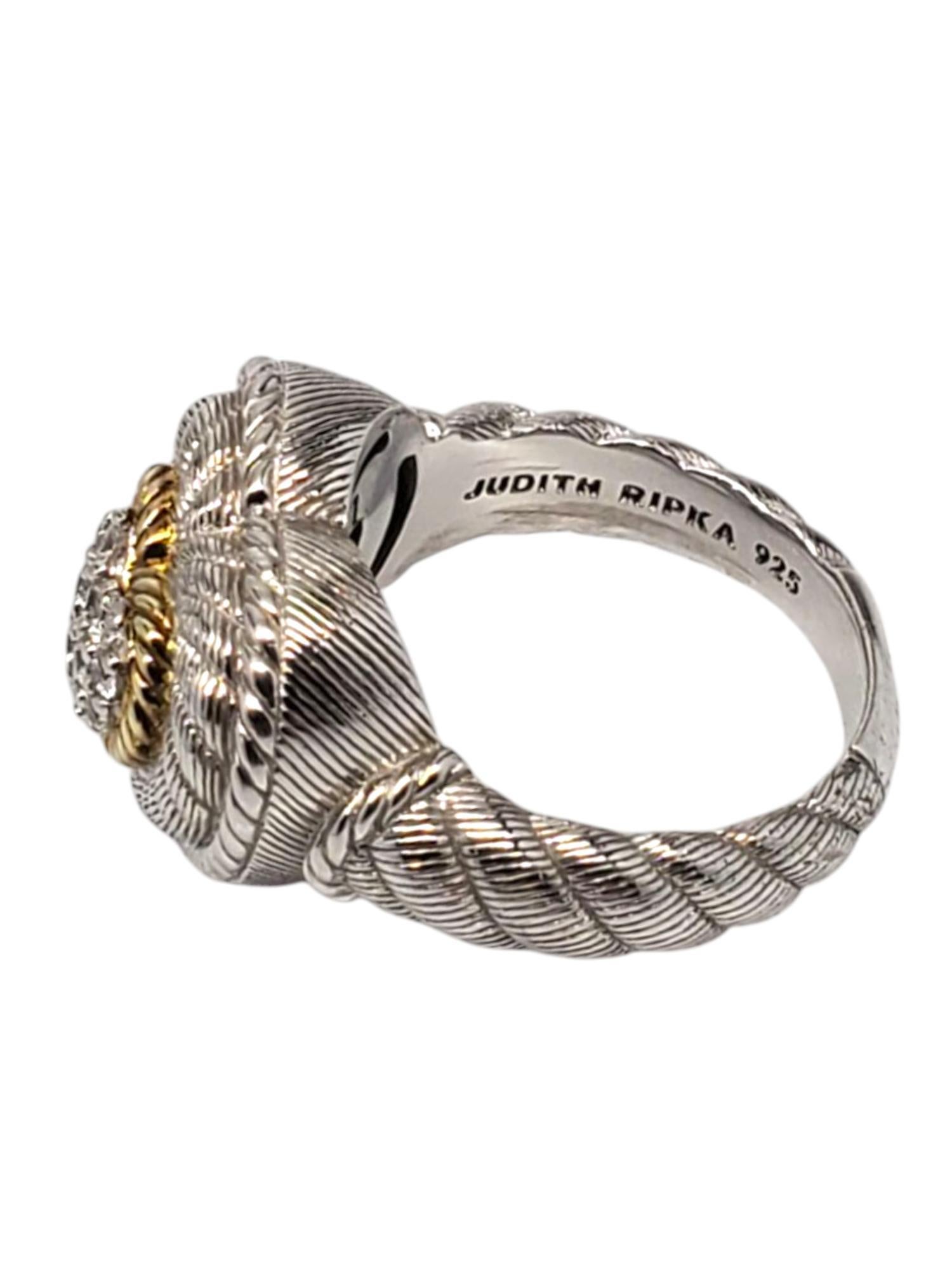 Judith Ripka Sterling Silver & Gold Tone CZ Pave Heart Ring -

This lovely ring by Judith Ripka features a CZ pave heart outlined in gold tone set in a sterling silver twisted rope design.

Shank: 4 mm

Front of ring approx. 16.5 mm x 18 mm x 10 mm