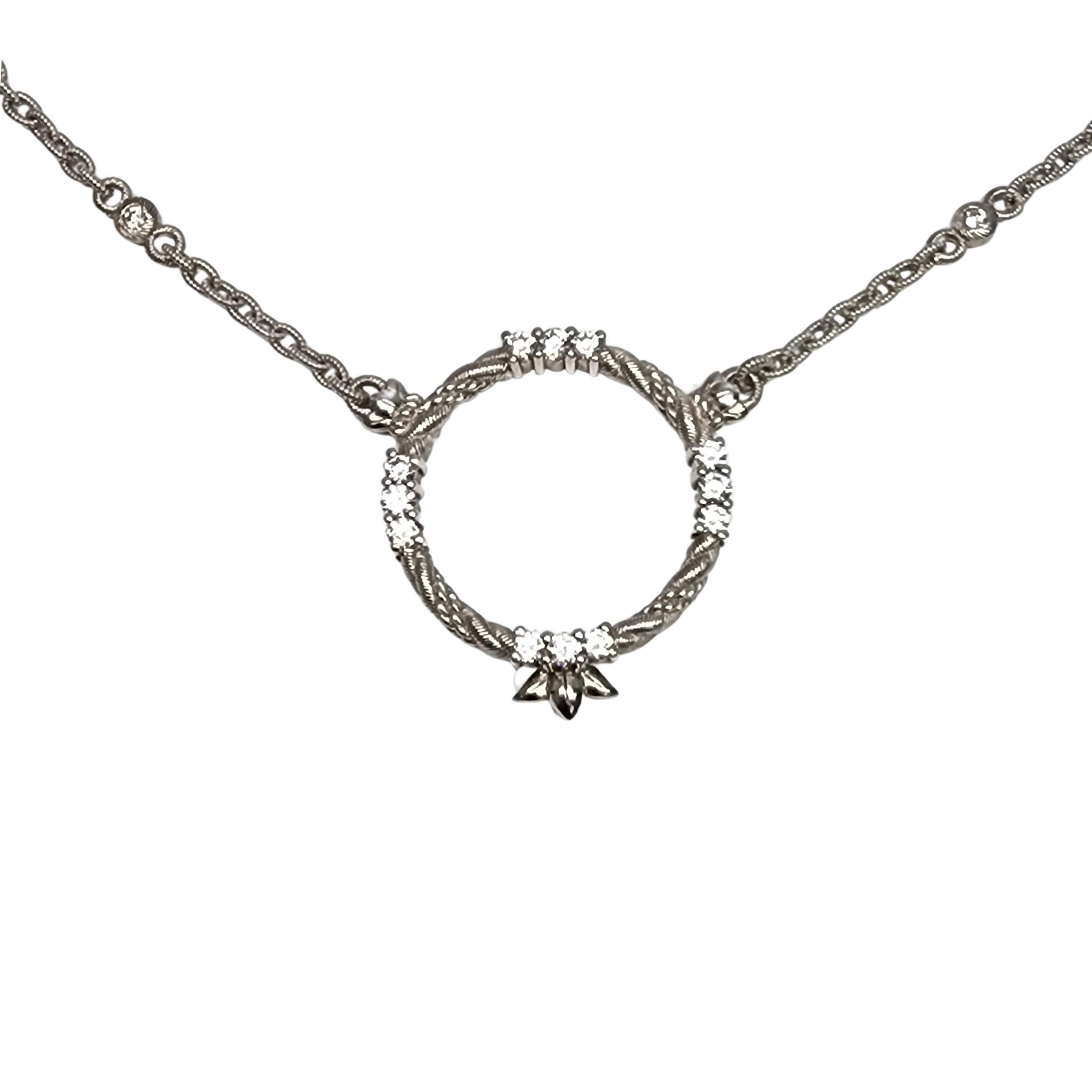 Sterling silver CZ circle pendant heart clasp chain necklace by Judith Ripka.

Beautiful round CZ pendant on a chain featuring CZ stations. Heart shaped CZ adorned clasp.

Weighs approx 15.7g, 10.1dwt

Measures approx 18