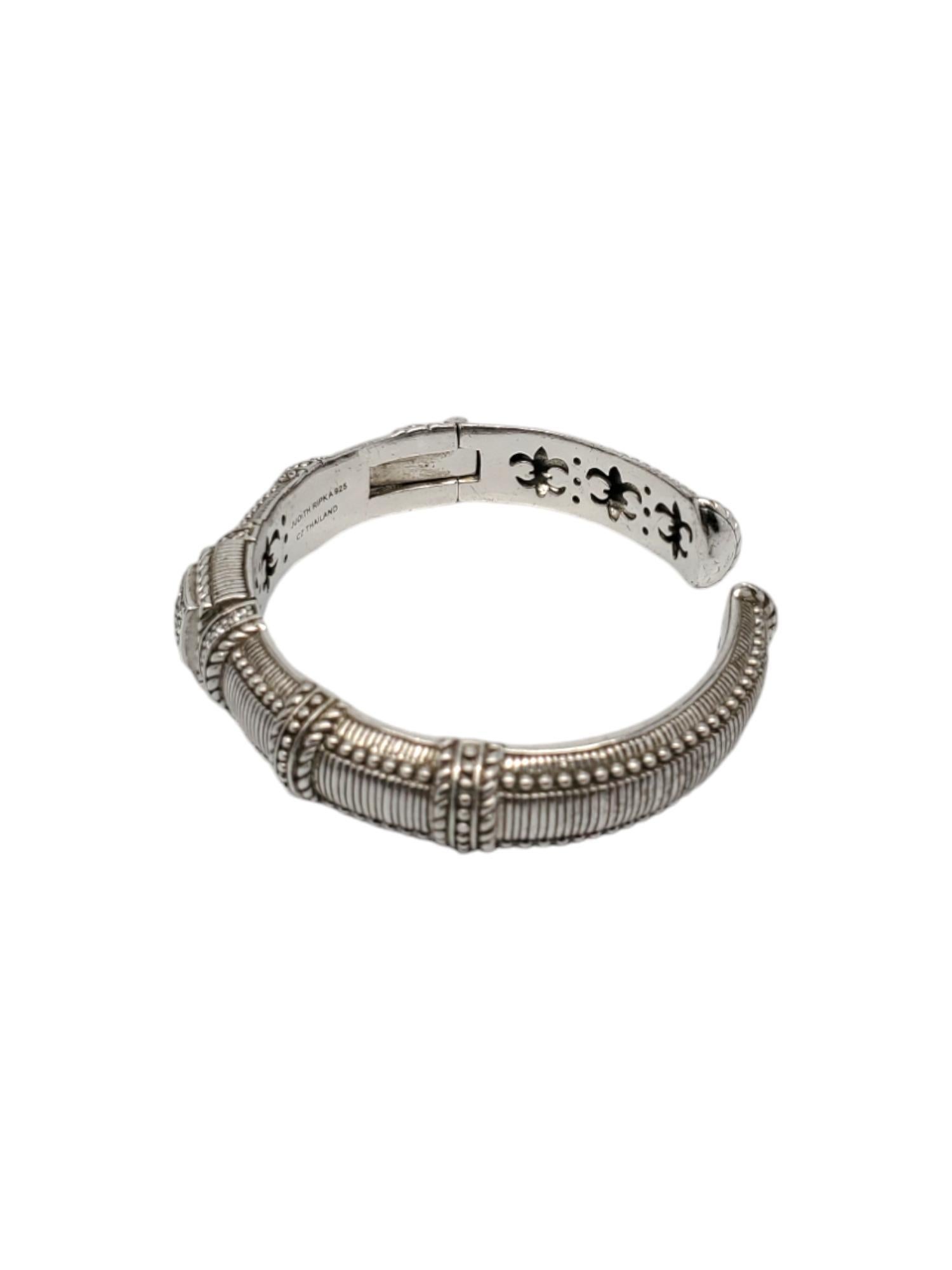 Judith Ripka Sterling Silver CZ Hinged Bracelet-

This vintage hinged cuff. bracelet by Judith Ripka is crafted in classic sterling silver with cz stones .

Fits up to 6.75