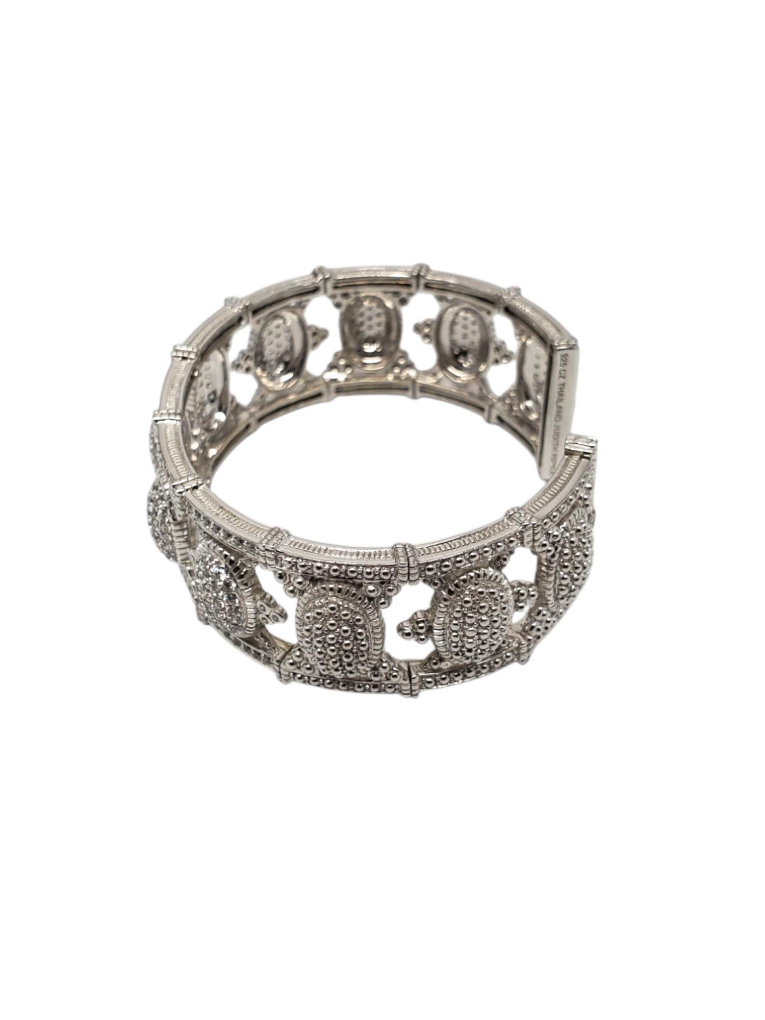 Judith Ripka Sterling Silver CZ Cuffed Bracelet -

This elegant cuff bracelet by Judith Ripka features an open cut CZ design set in sterling silver.

Size: approx. 6.5 in. in circumference all around inside - flexible

Approx. 3/4