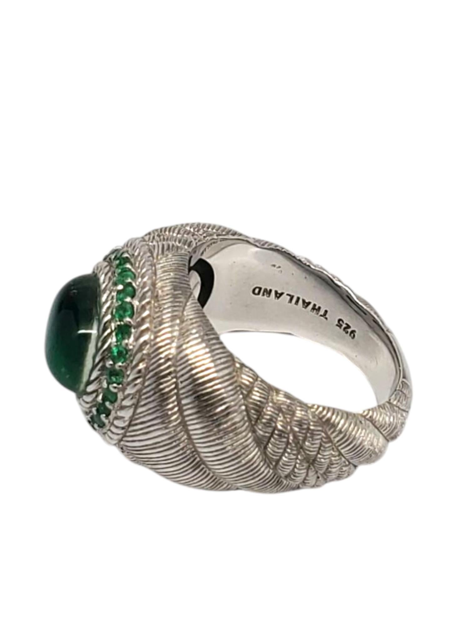 Judith Ripka Sterling Silver Green Oval Cabochon Ring

This stunning ring features a large green oval cabochon (9.76 mm x 7.79 mm) surrounded by smaller round stones set in a sterling silver textured pattern by Judith Ripka.

Shank: 5 mm

Front of