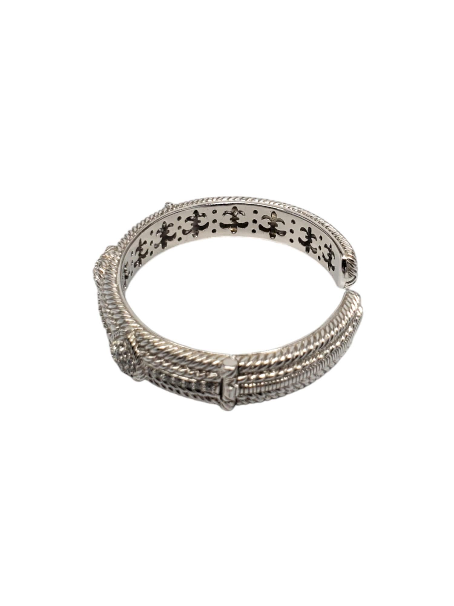 Judith Ripka Sterling Silver Heart Cubic Zirconia Hinged Cuff Bracelet-

This stunning Judith Ripka hinged cuff bracelet features 3 cz hearts set in sterling silver.

Size: Fits up to 7