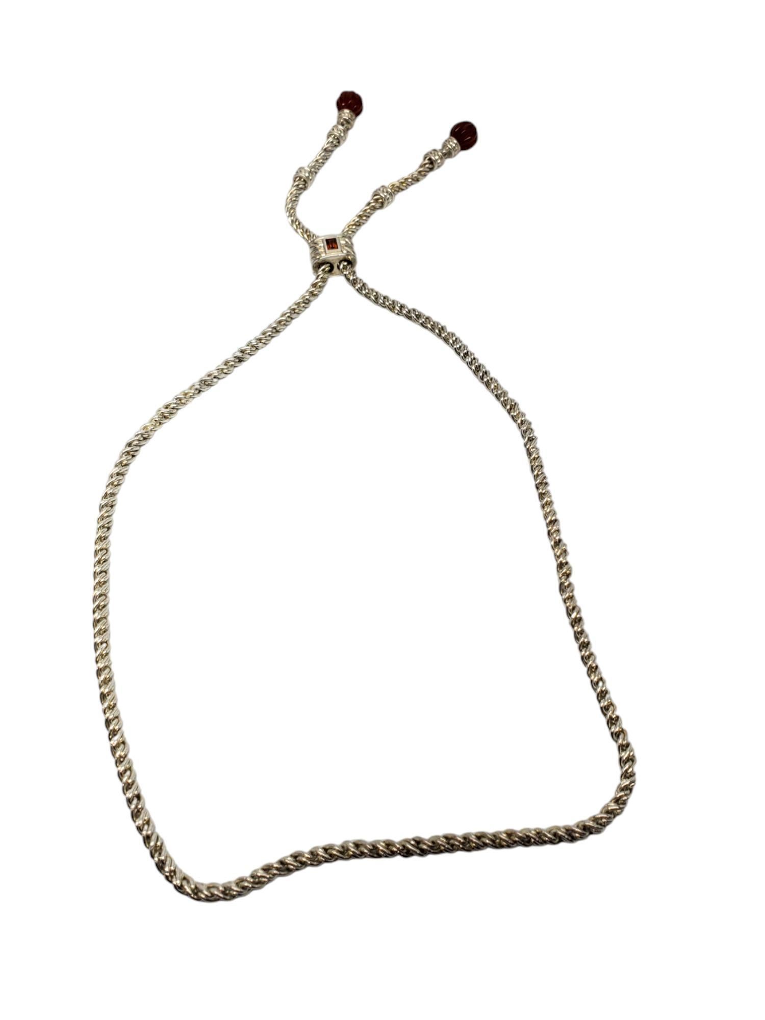 Judith Ripka Sterling Silver Lariat Drop Necklace -

This drop necklace by Judith Ripka features a citrine gemstone and two gemstone beads in classic sterling silver.

Size: 30 in. - adjustable

Stamped: JUDITH RIPKA 925 THAILAND

Weigh: 54.9dwt./