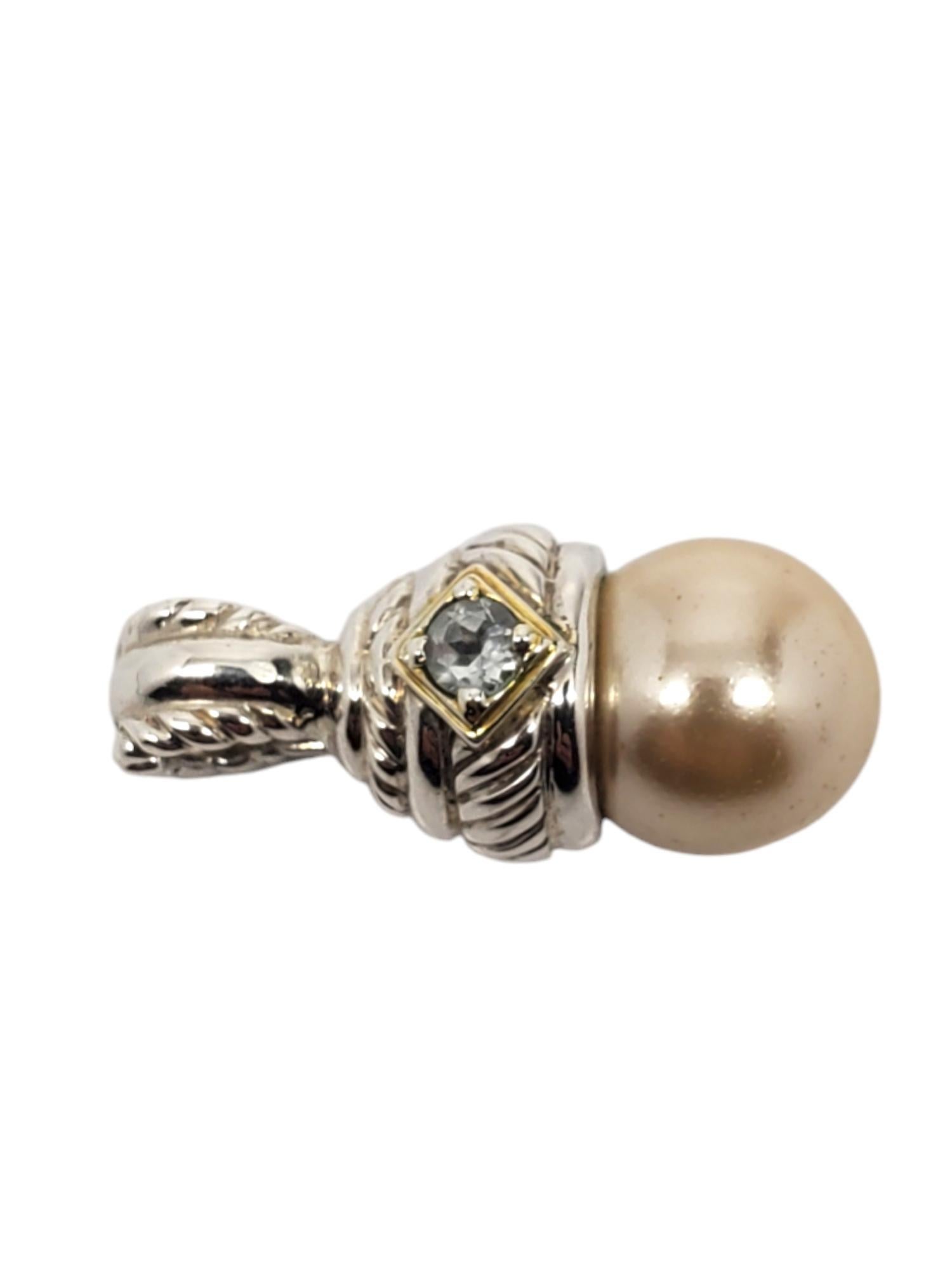 Judith Ripka Sterling Silver Pearl & Lolite Pendant / Enhancer

This vintage enhancer pendant by Judith Ripka features a beautiful pearl with lolite accent gemstone set in sterling silver.

Size: 33.3 mm x 14.9 mm

Stamped: Judith Ripka 925