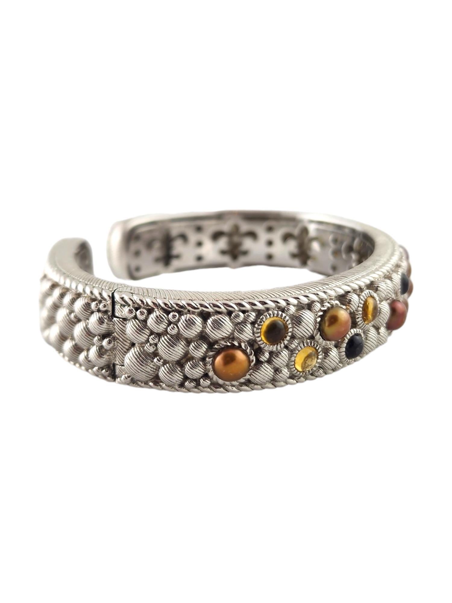 Judith Ripka Sterling Silver Pearl Multi Gemstone Hinged Cuff Bracelet

This beautiful, hinged cuff bracelet by designer Judith Ripka features a variety of multicolored pearls and gemstones all set in sterling silver with amazing