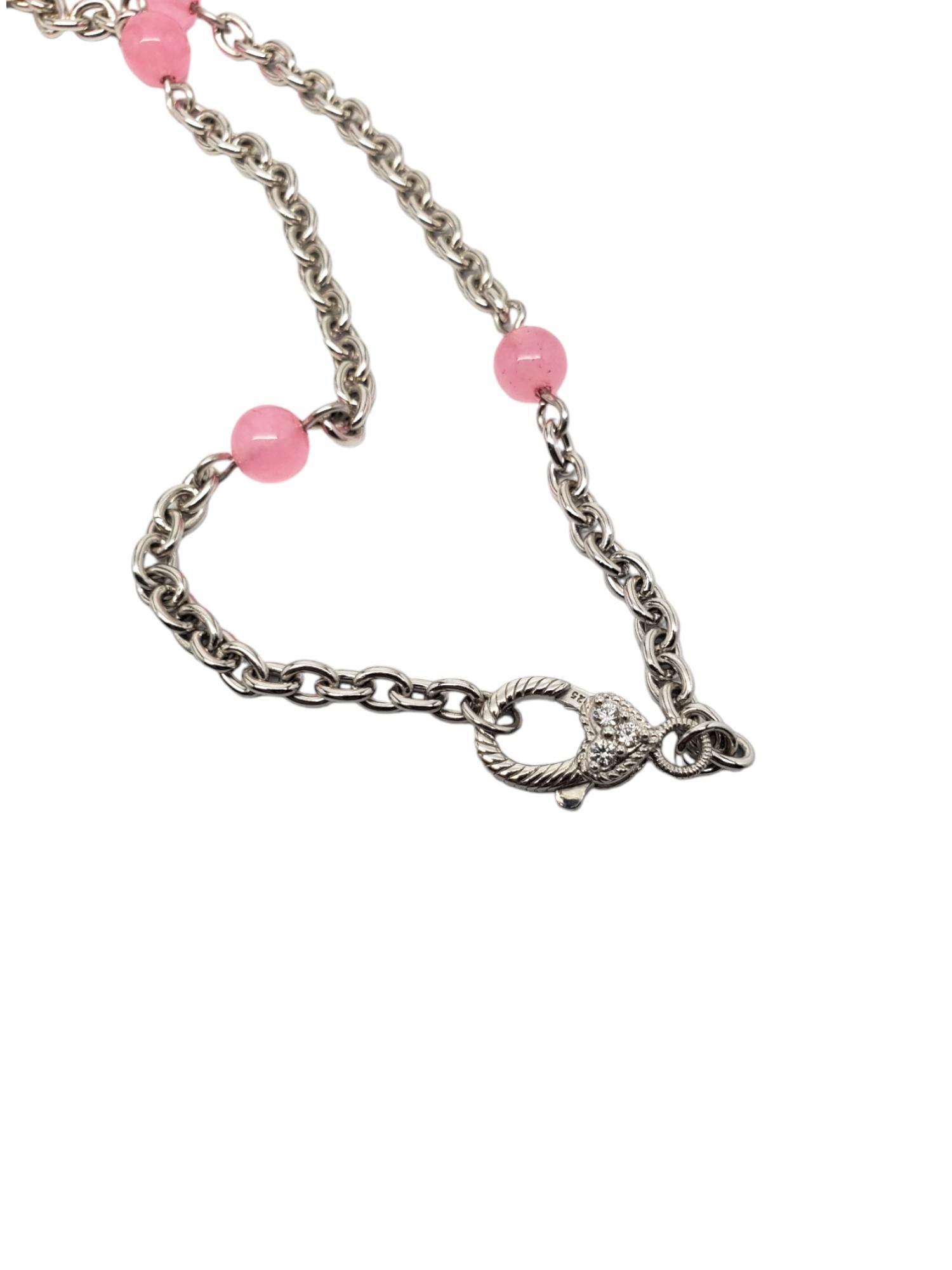 Judith Ripka Sterling Silver Pink Beaded Chain With Heart Pendant -

This unique Judith Ripka chain necklace with enhancer features pink jadeite beads and matching heart and cz accents in sterling silver.

Size: 20 in.

Stamped: JUDITH RIPKA 925 CZ