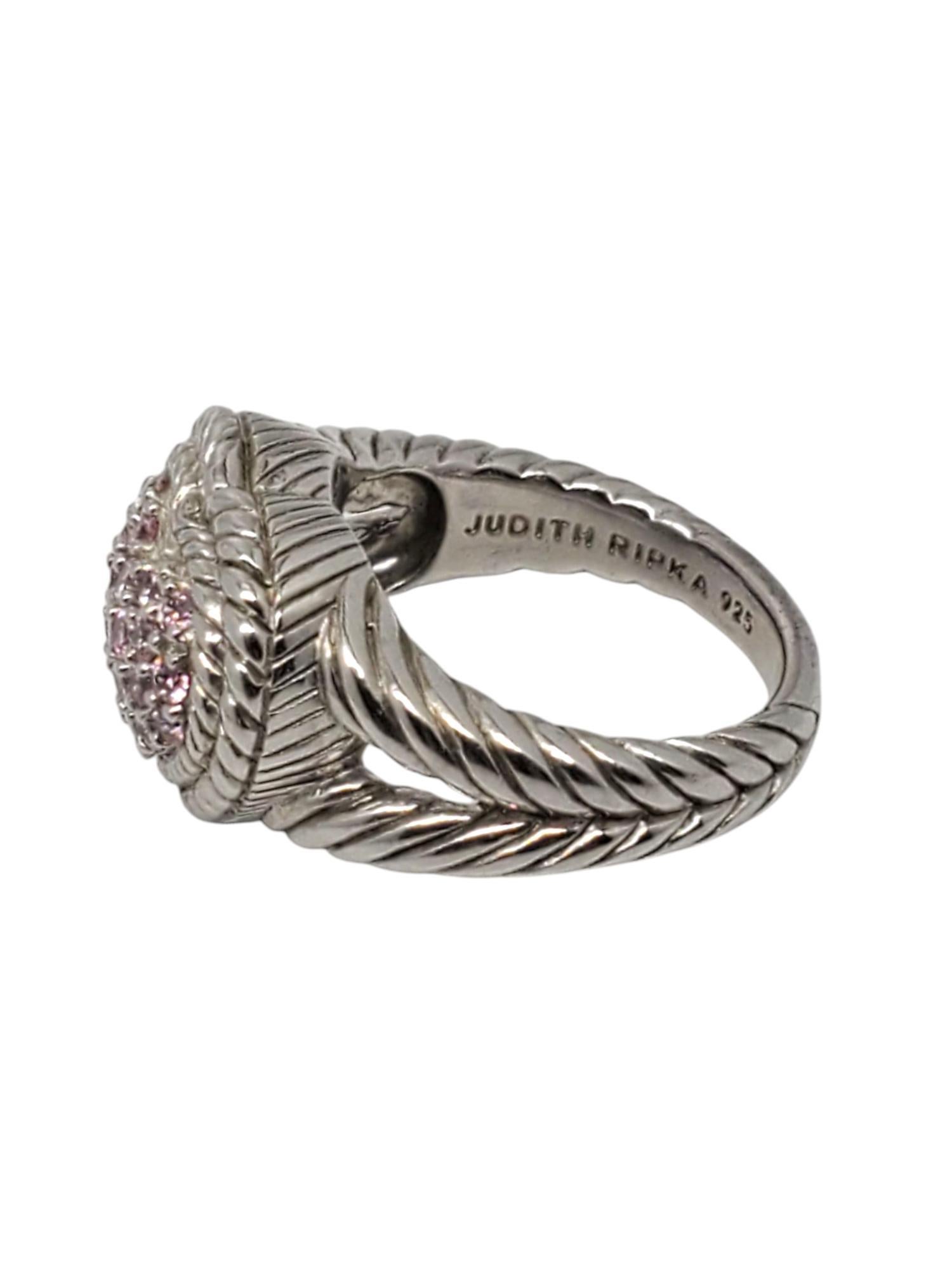 Judith Ripka Sterling Silver Pink CZ Pave Heart Ring-

This beautiful ring features a heart shaped design with pink CZ stones in a twisted rope textured band set in sterling silver by Judith Ripka.

Shank: 3 mm

Front of ring approx. 15 mm x 17 mm x