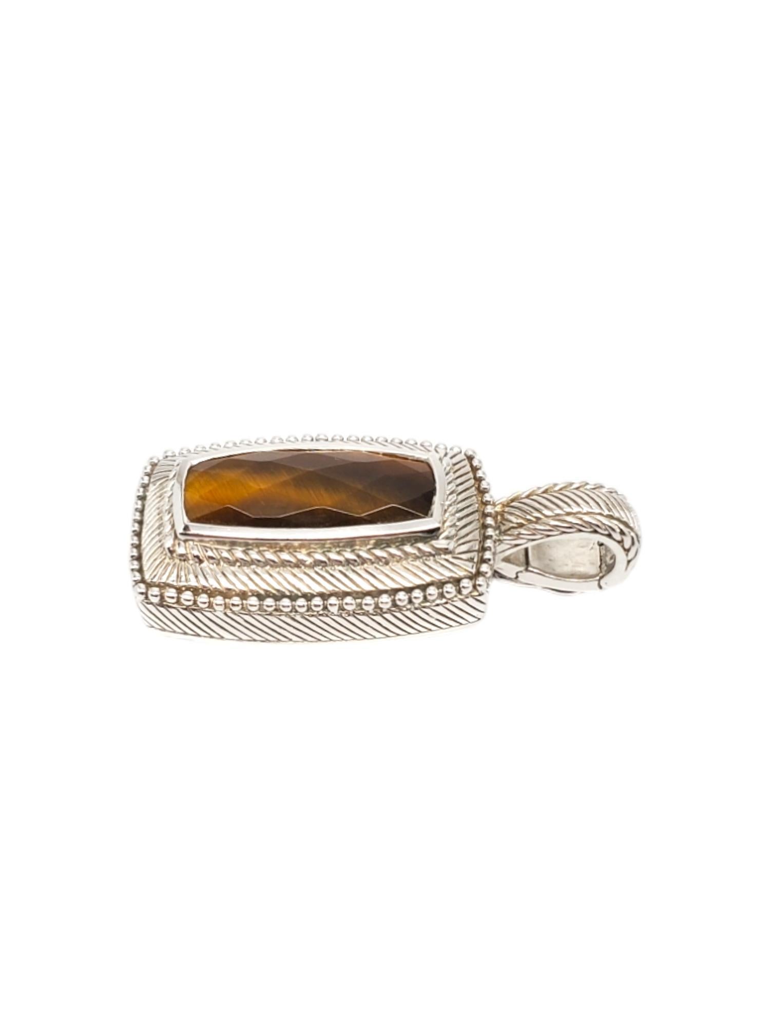 Judith Ripika Sterling Silver Tiger Eye Pendant

This Judith Ripka tiger eye pendant is meticulously set in sterling silver with enhancer.

Stamped: JUDITH RIPKA 925 CZ THAILAND

Weight: 7.44 dwt./ 11.57 gr.

*Chain not Included.

Very good