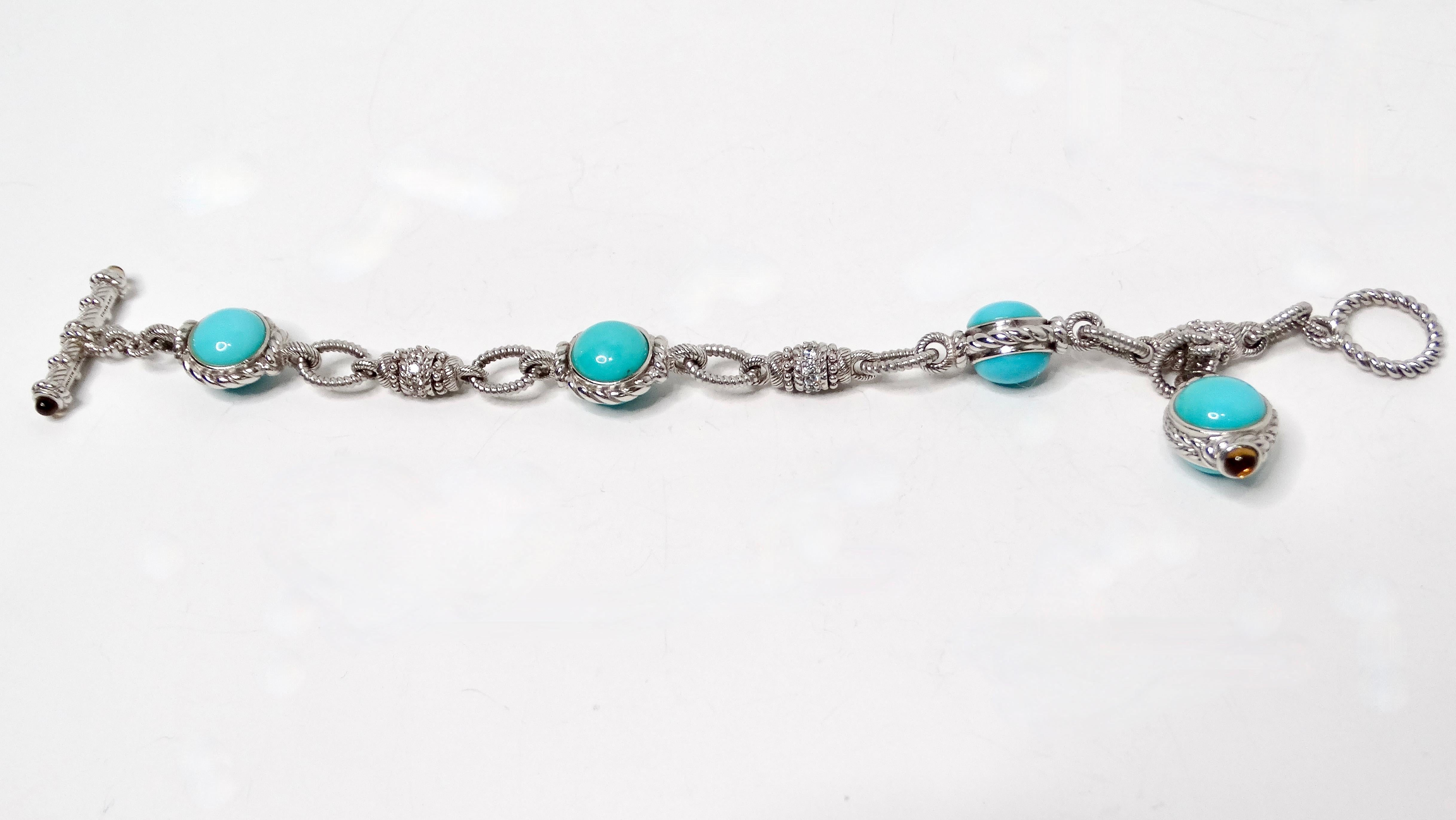 Le bracelet à bascule en argent sterling Turquoise et Citrine de Judith Ripka est une pièce étonnante qui allie sans effort l'élégance à une touche de couleur vibrante. Fabriqué en argent sterling de haute qualité, ce bracelet est orné de pierres