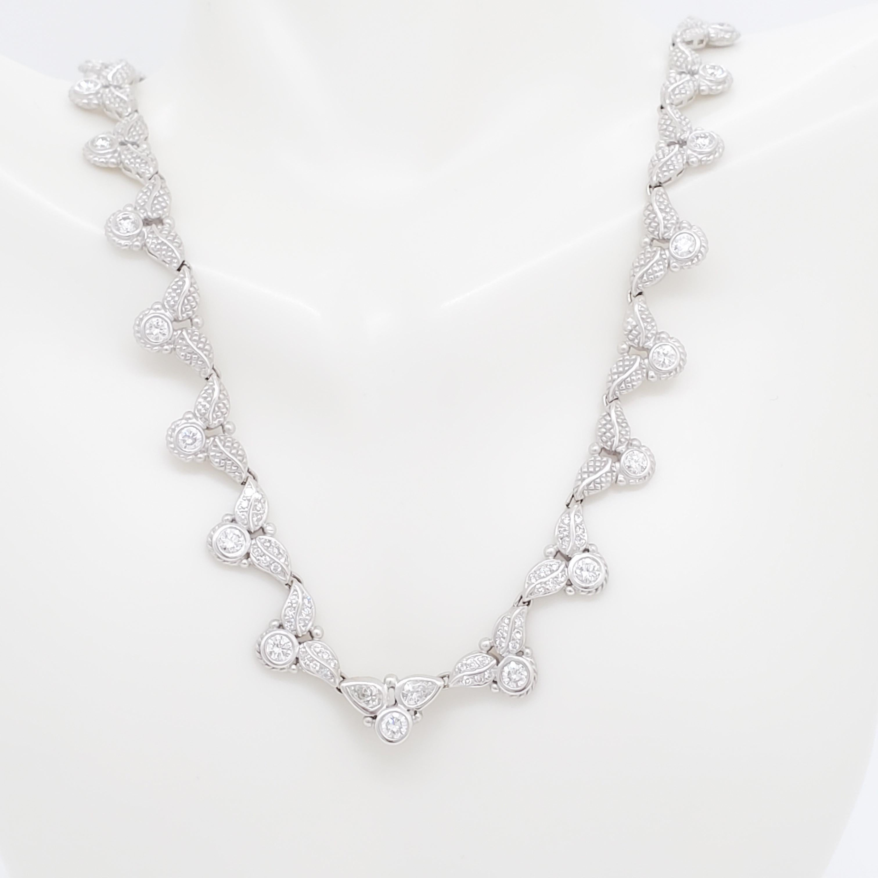 Gorgeous Judith Ripka necklace with 4.50 ct. good quality white diamond rounds.  Handmade in 18k white gold.  