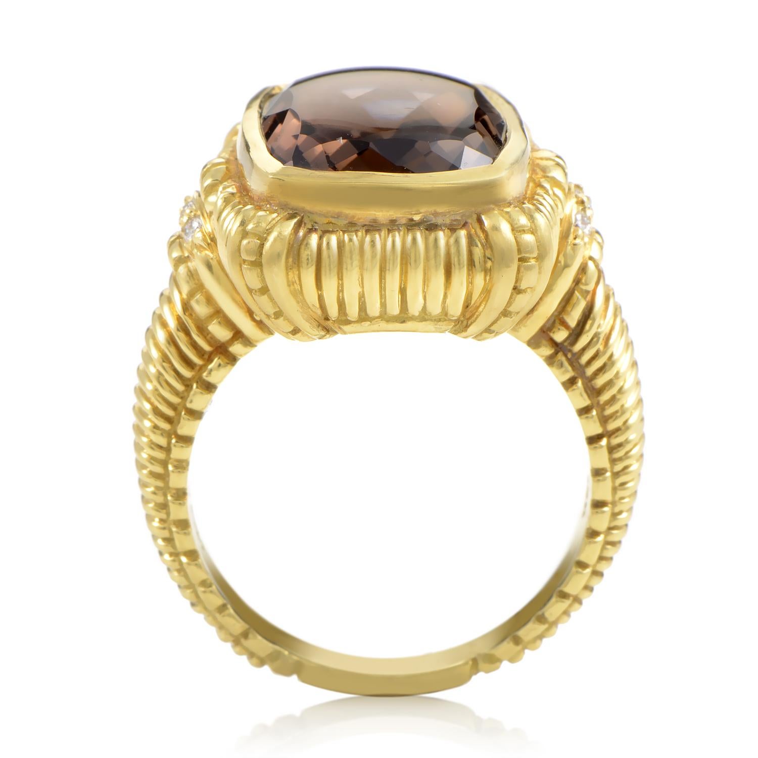Commanding yet sensuous, this Judith Ripka ring is a mysterious yet glamorous piece. A custom faceted smokey topaz graces the 18K yellow gold ring in a matte finish that is styled in a filigree manner. On either side of the topaz are clusters of