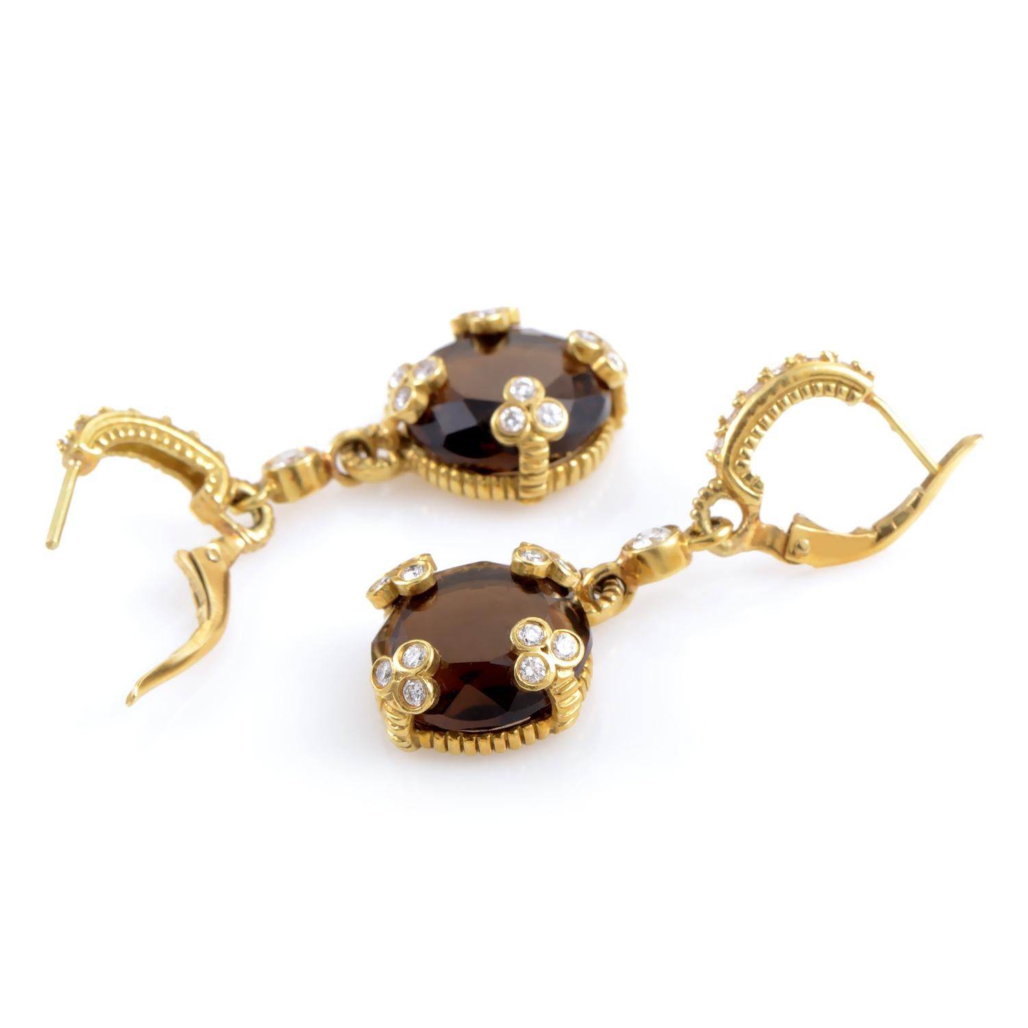 Delicately detailed and daring, these Judith Ripka Earrings are perfect for the woman who knows what she wants and how to get it. The 18K gold gives a warmth and glow to the smokey quartz at the end of these pendant earrings. Held into place by