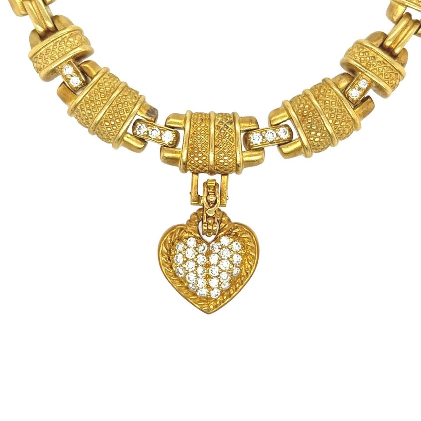 An 18 karat yellow gold, rock crystal, emerald and diamond necklace and two (2) pendants, Judith Ripka.  The necklace formed of textured barrel shaped links alternating with fluted bar links, enhanced at the front by ten (10) round brilliant cut