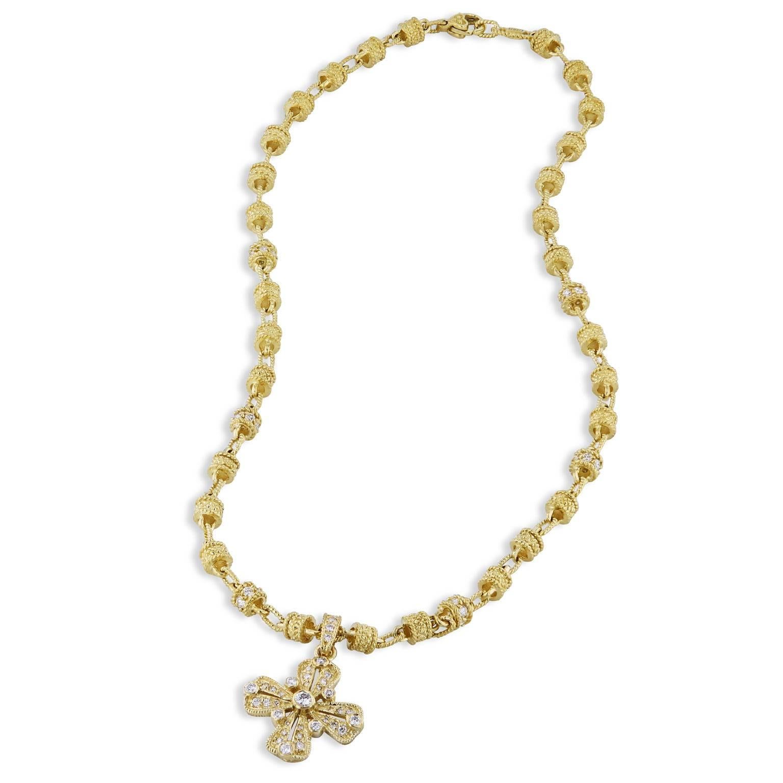 Enjoy this previously loved 18 karat yellow gold, 17 inch Judith Ripka necklace with removable Gothic Maltese diamond cross featuring sixty-nine diamonds (G/H/SI1).