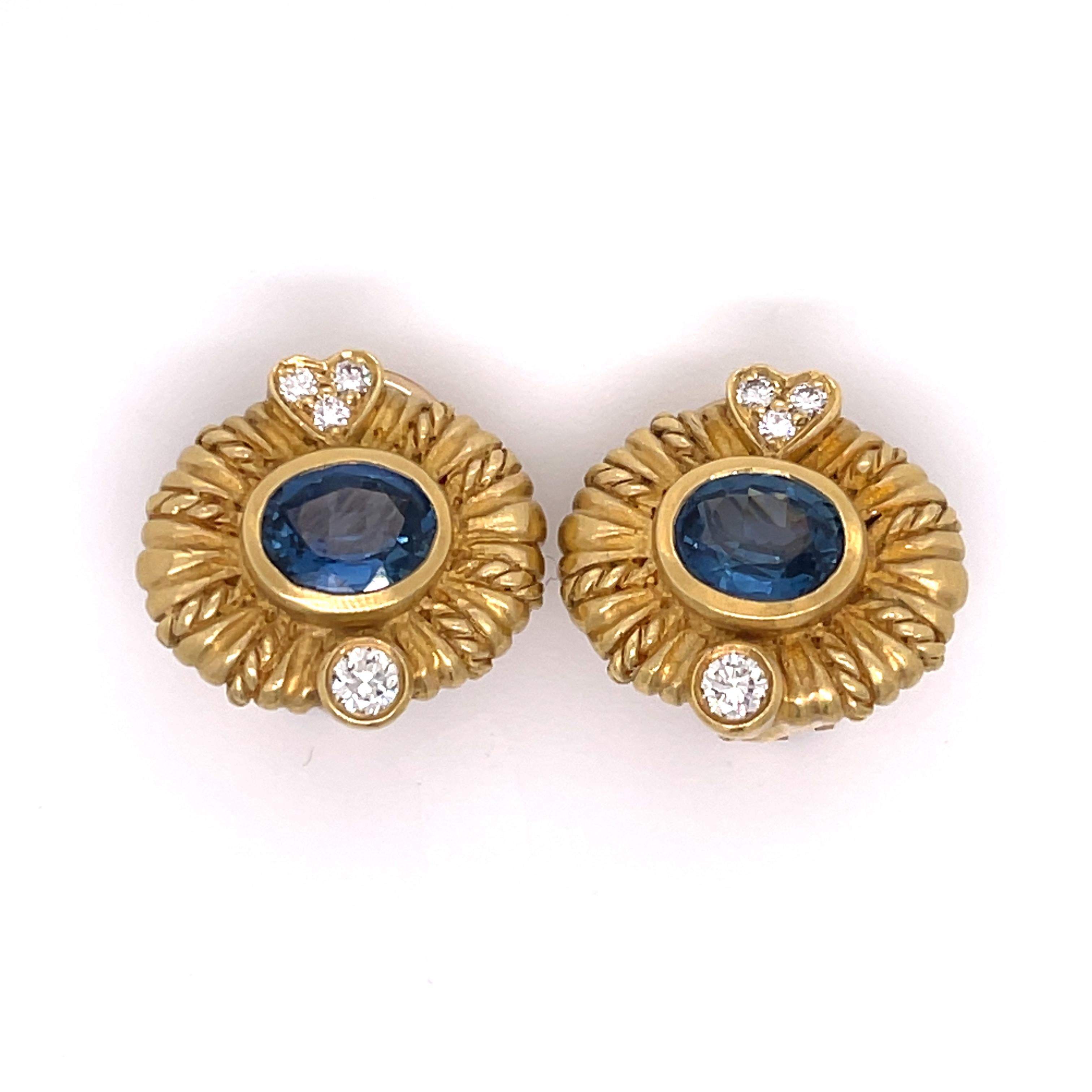 Judith Ripka 18K Yellow Gold Sapphire and Diamond Earrings. These sweet treats for your ear are clip on for the clip on fans. They also have the ability to drop charms off them. Sweet hearts at the top of earring which have three diamonds in them.