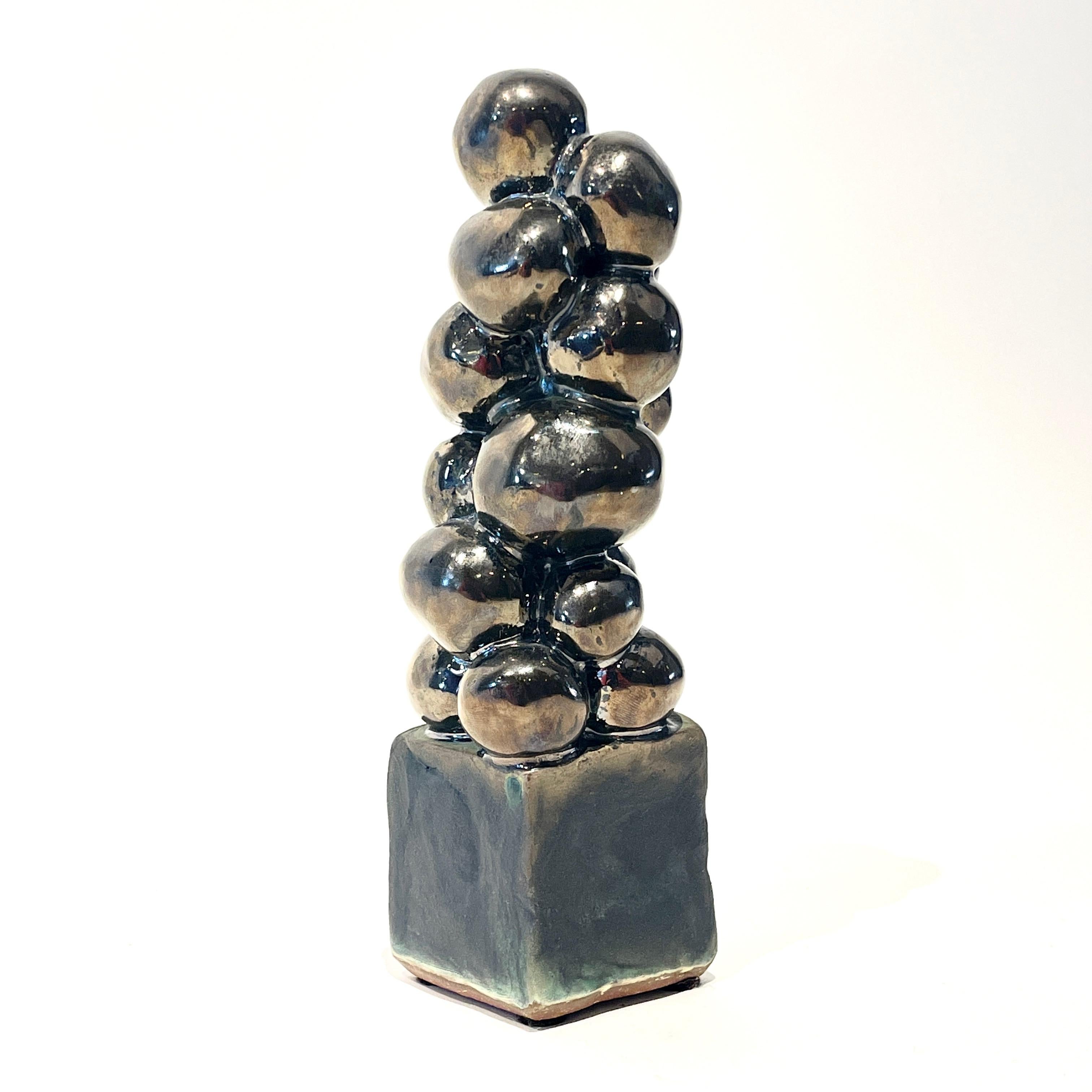 Judy Engel 
'Palline di Platino
2019 Glazed Ceramic 


 Greatly influenced by the modernism of the middle of the 20th century, Judy's first introduction to this style was the Empire State Plaza in Albany, NY. 