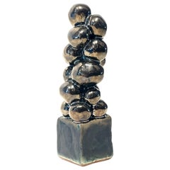 Escultura de cerámica esmaltada metalizada y bronce envejecido "Palline di Platino