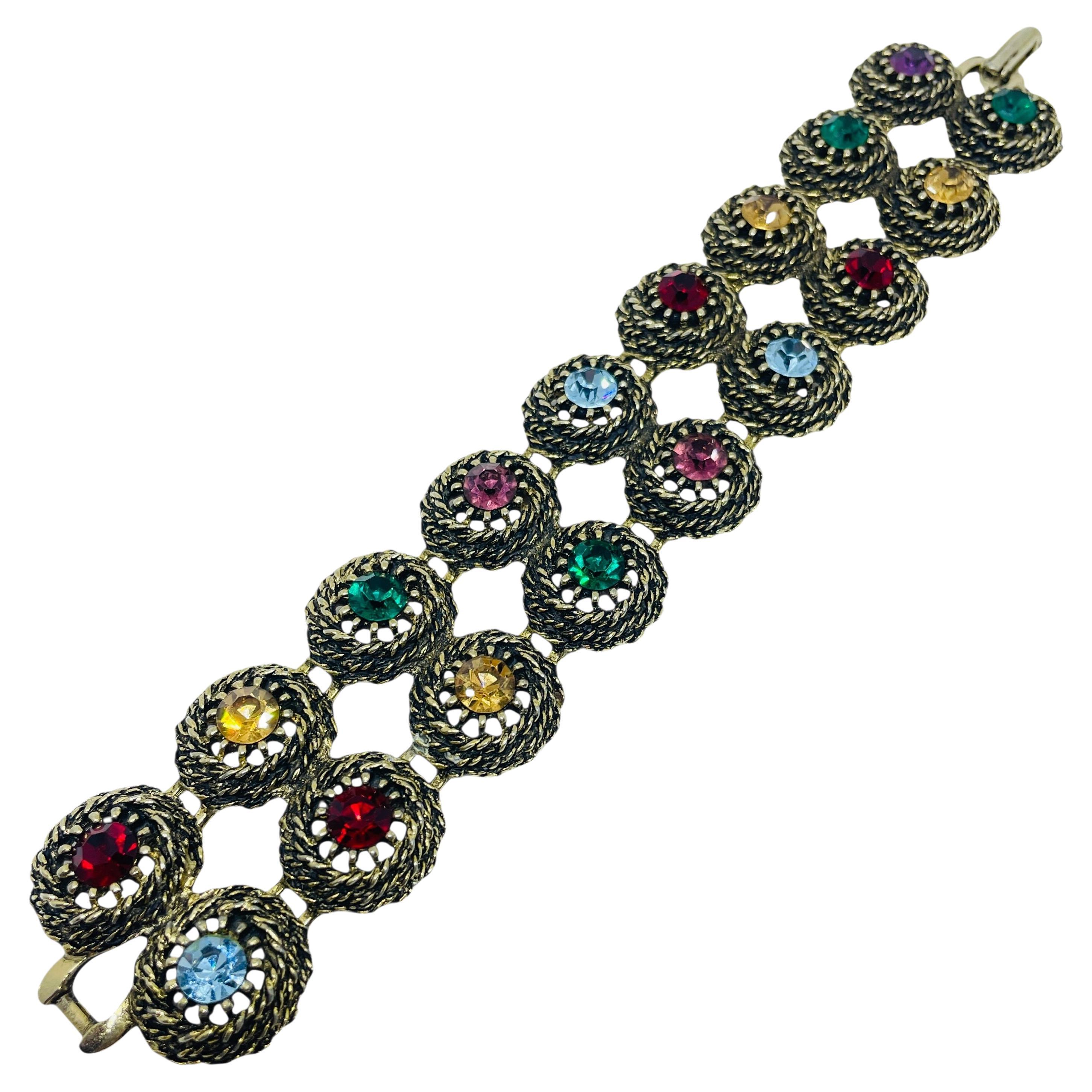 Bracciale firmato JUDY LEE, vintage, in tonalità oro, con strass e gioielli colorati