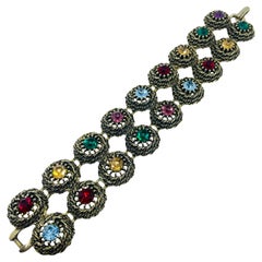 Bracciale firmato JUDY LEE, vintage, in tonalità oro, con strass e gioielli colorati