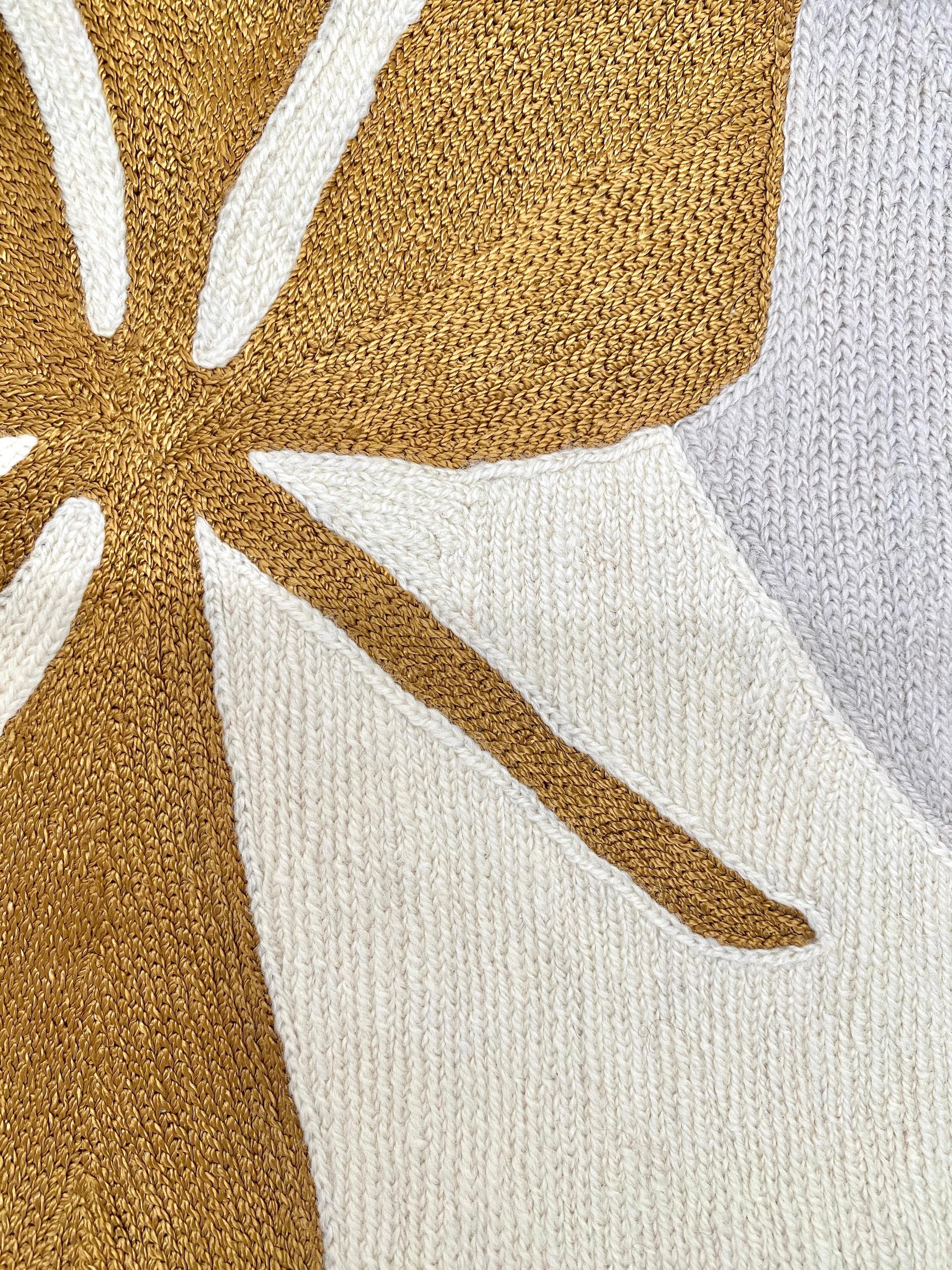 Judy Ross is a New York based designer and artist. Traveling in India to work as an independent textile designer, she developed a passion for the centuries-old hand embroidery technique known as chain stitch, used by men in the Kashmir region to