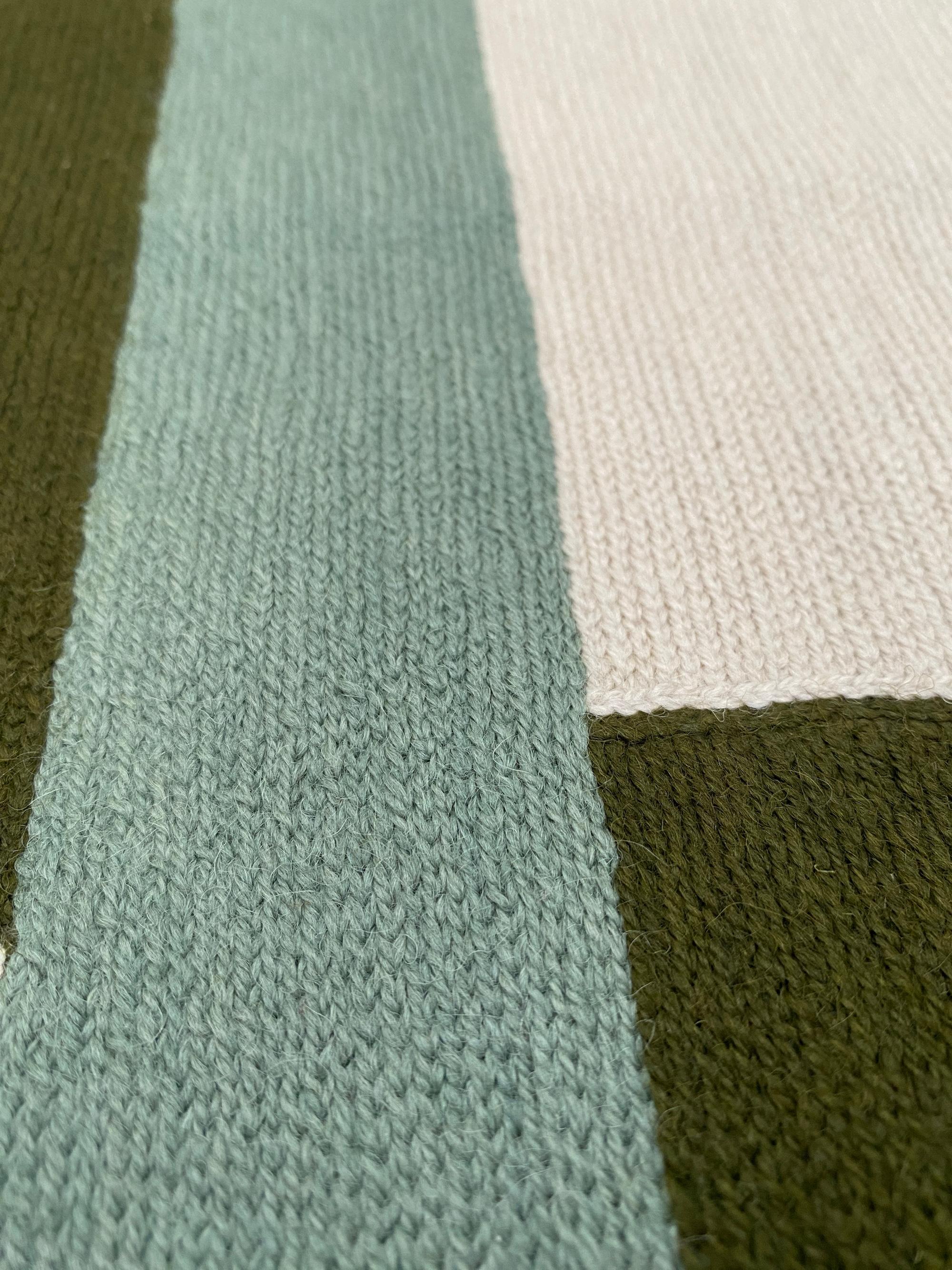 Judy Ross is a New York based designer and artist. Traveling in India to work as an independent textile designer, she developed a passion for the centuries-old hand embroidery technique known as chain stitch, used by men in the Kashmir region to