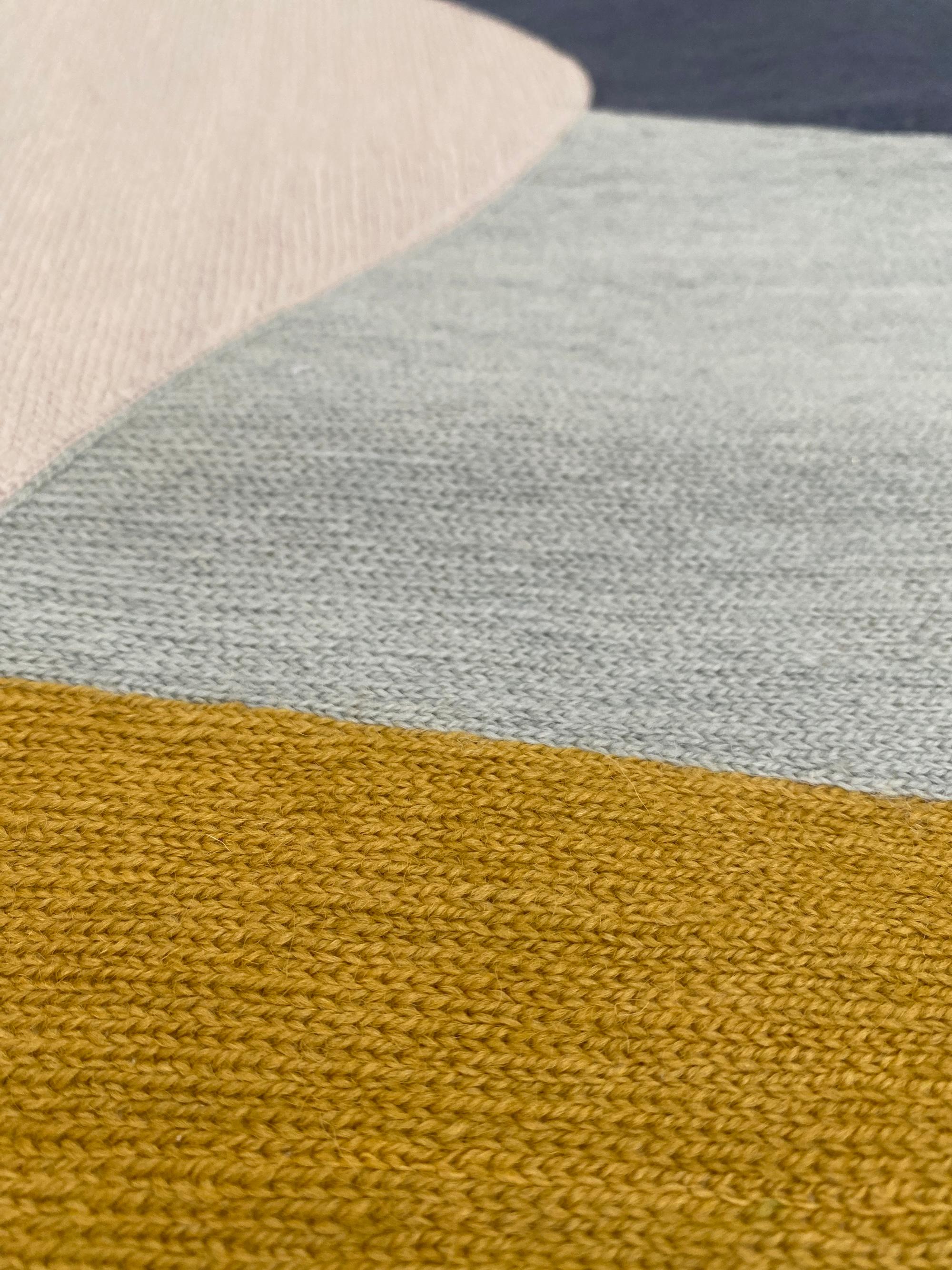 Judy Ross is a New York based designer and artist. Traveling in India to work as an independent textile designer, she developed a passion for the centuries-old hand embroidery technique known as chain stitch, used by men in the Kashmir region to