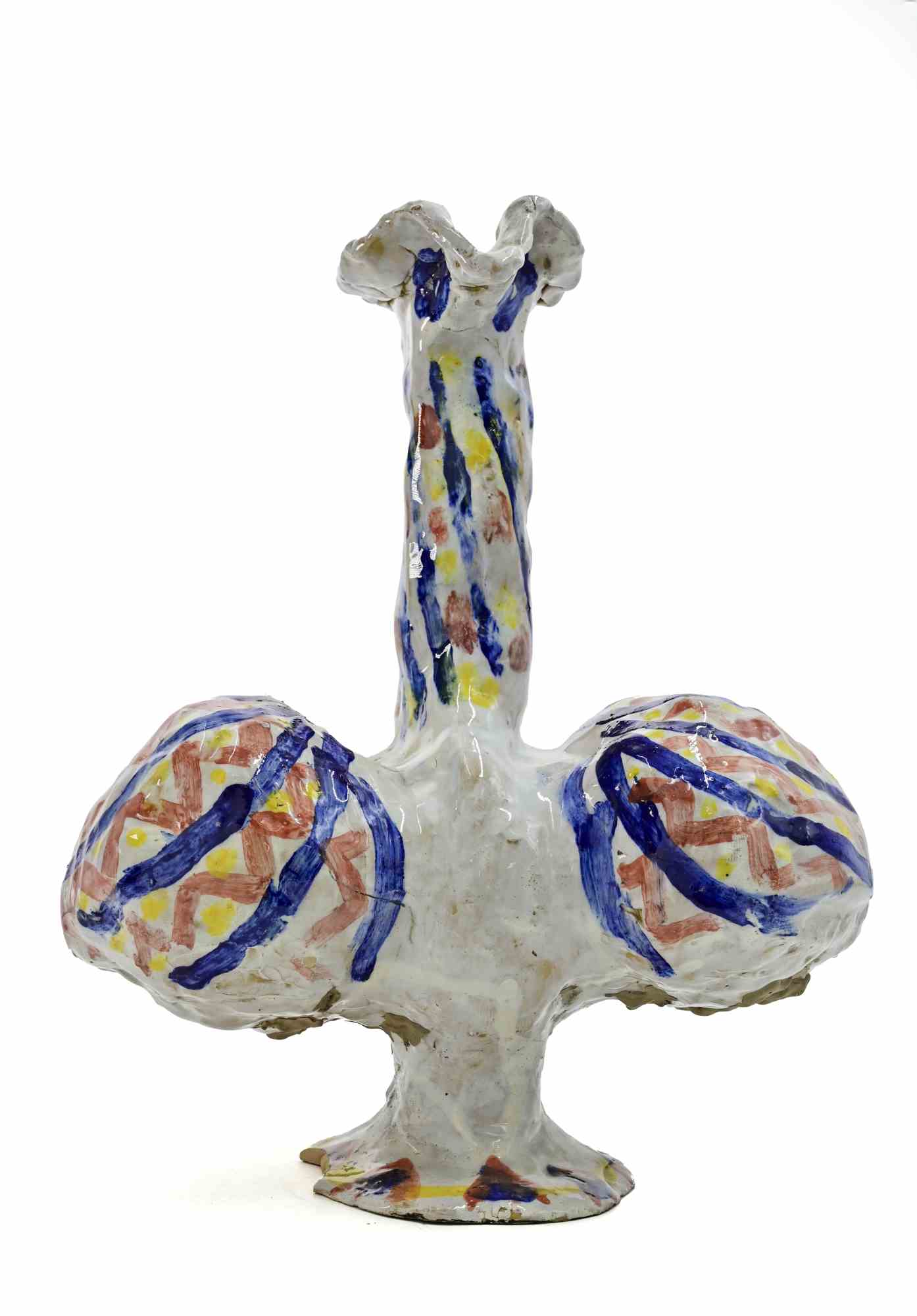Scultura in ceramica realizzata da Sirio Pellegrini negli anni '60.

Buone condizioni, a parte una scheggiatura sulla base.

Sirio Pellegrini, nato a Roma il 1 marzo 1922, di origini abruzzesi (Capestrano), ha trascorso gli anni dell'infanzia a
