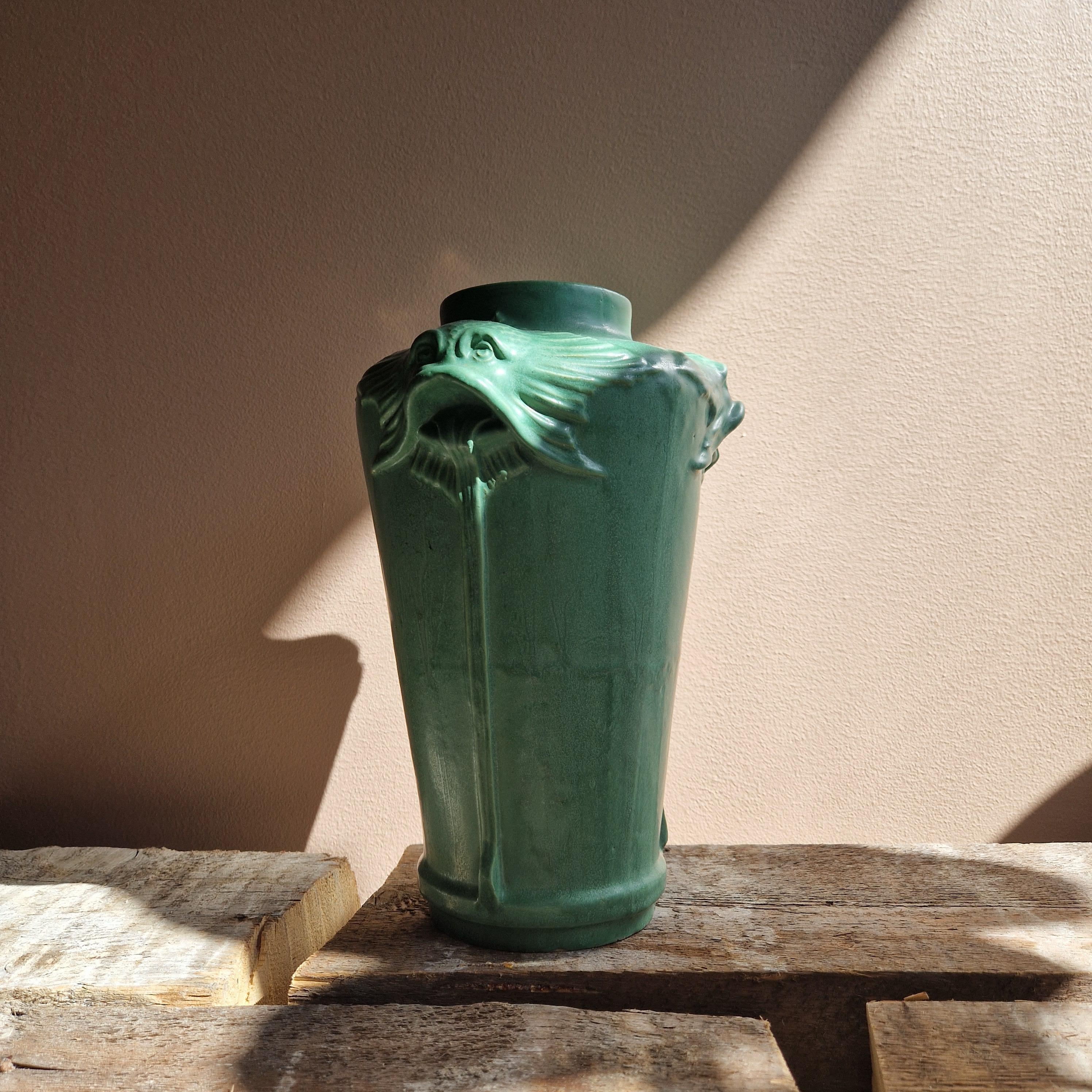 A very rare fish head vase made by Karl Svensson for Höganäs, Sweden. Made in the early 20th century.
A large true Jugend  ceramic vase glazed in green. Adorned with fishes in relief around the opening.
The vase is truly amazing and quite large in
