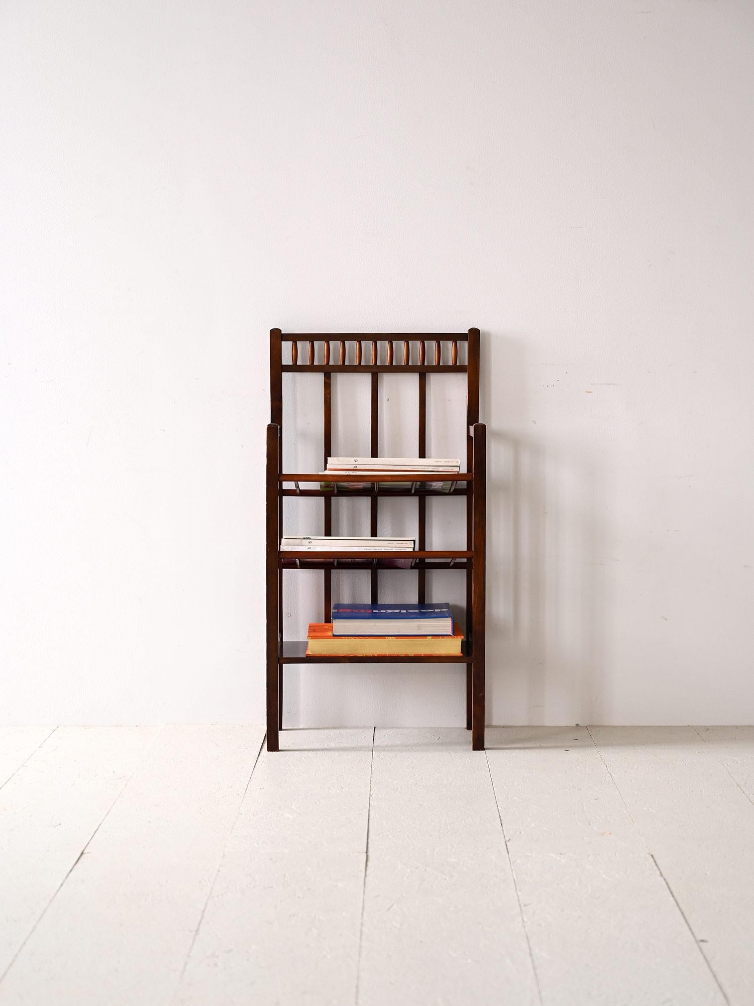 Wooden magazine rack designed in the 1940s Art Deco period.

Consists of a structure with regular lines and three wooden shelves.
Ideal as a magazine rack or bedside table for the bedroom.
The retro-flavored design will warm the room in perfect