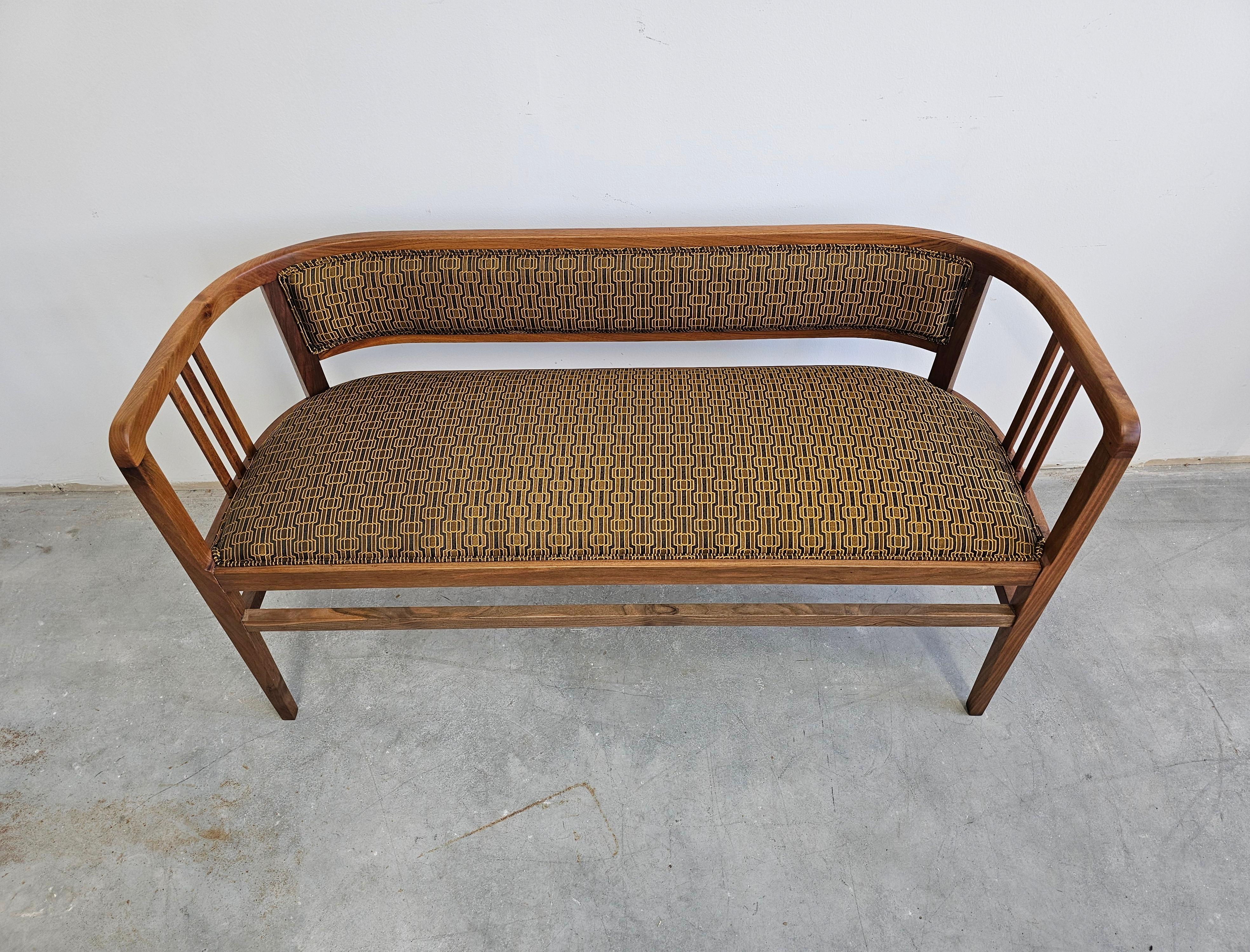 Jugendstil bench or settee done in solid walnut, reupholstered, Austria 1910s