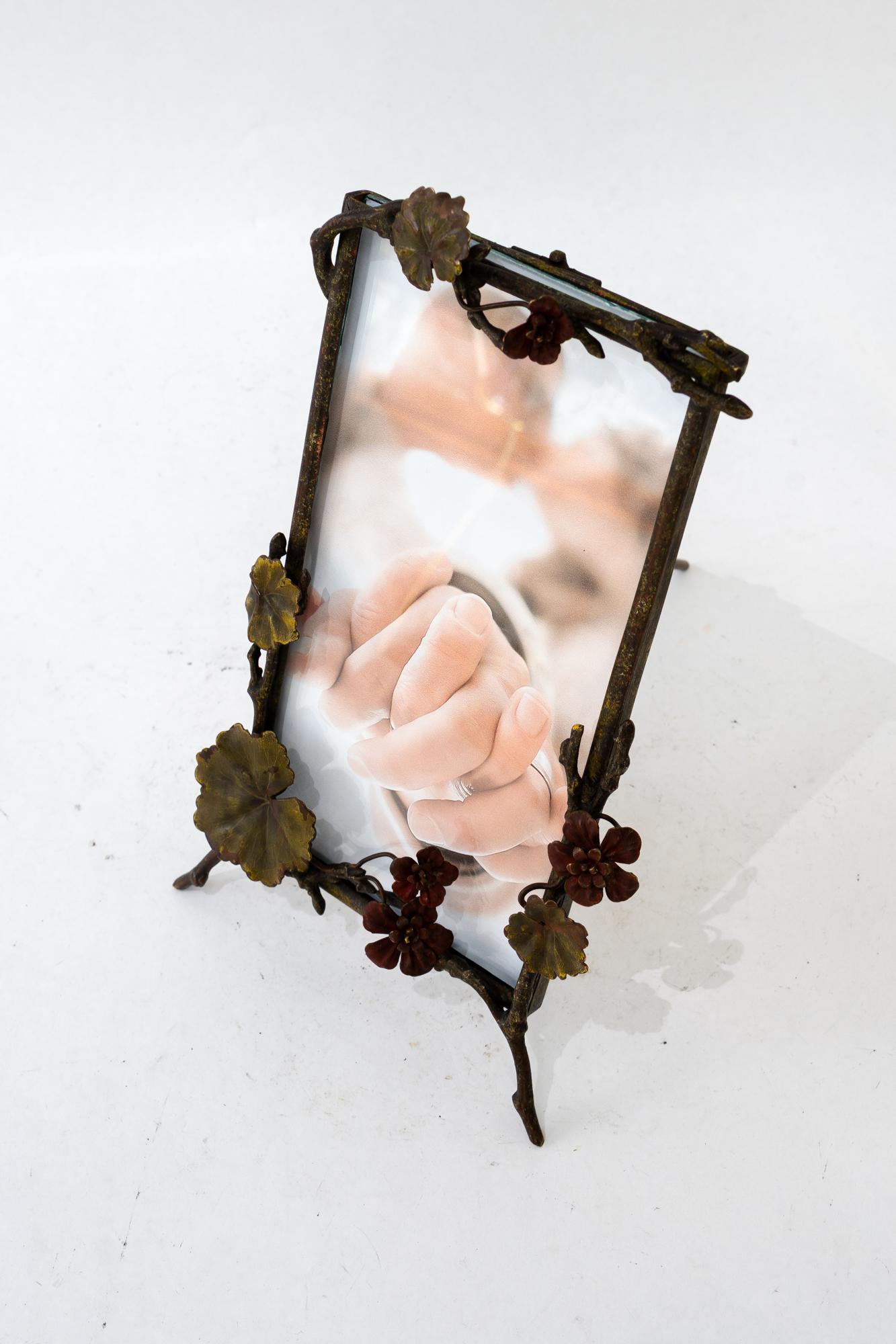 Jugendstil brass picture frame with glass around 1908
Blackened brass
Glass in Front
Picture size max:  20,5 x 11cm