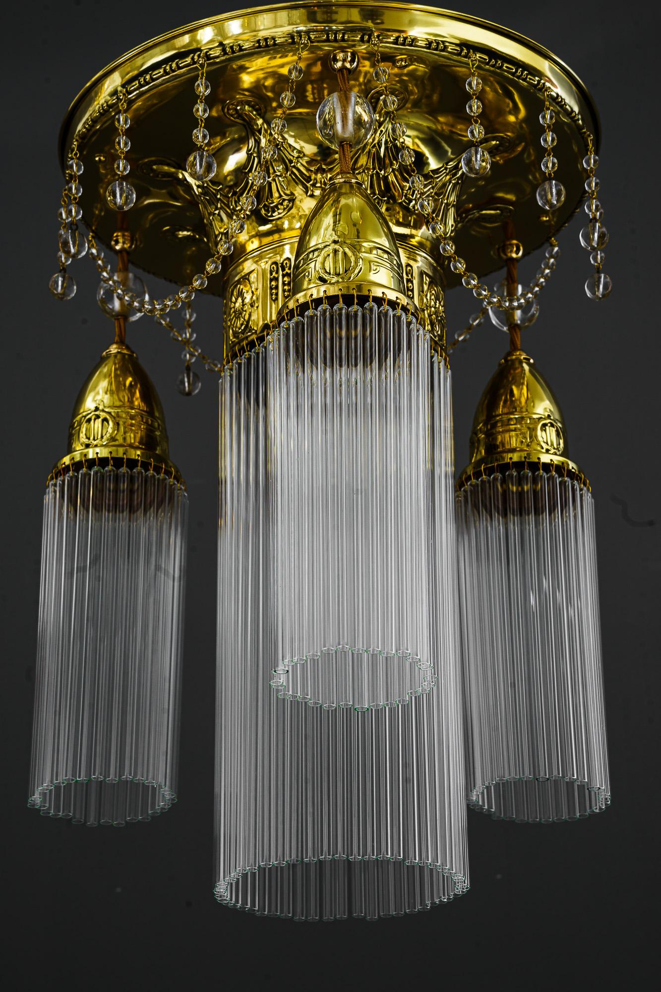 Jugendstil ceiling lamp vienna around 1908
Brass polished and stove enameled
the glass sticks are replaced ( new )