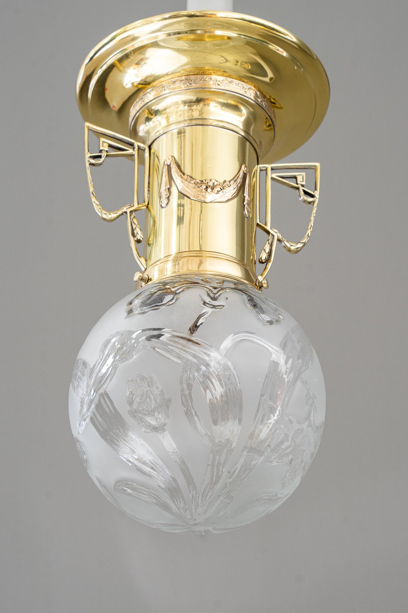 Jugendstil ceiling lamp vienna around 1908
Brass polished and stove enameled
Original antique floral glass shade
