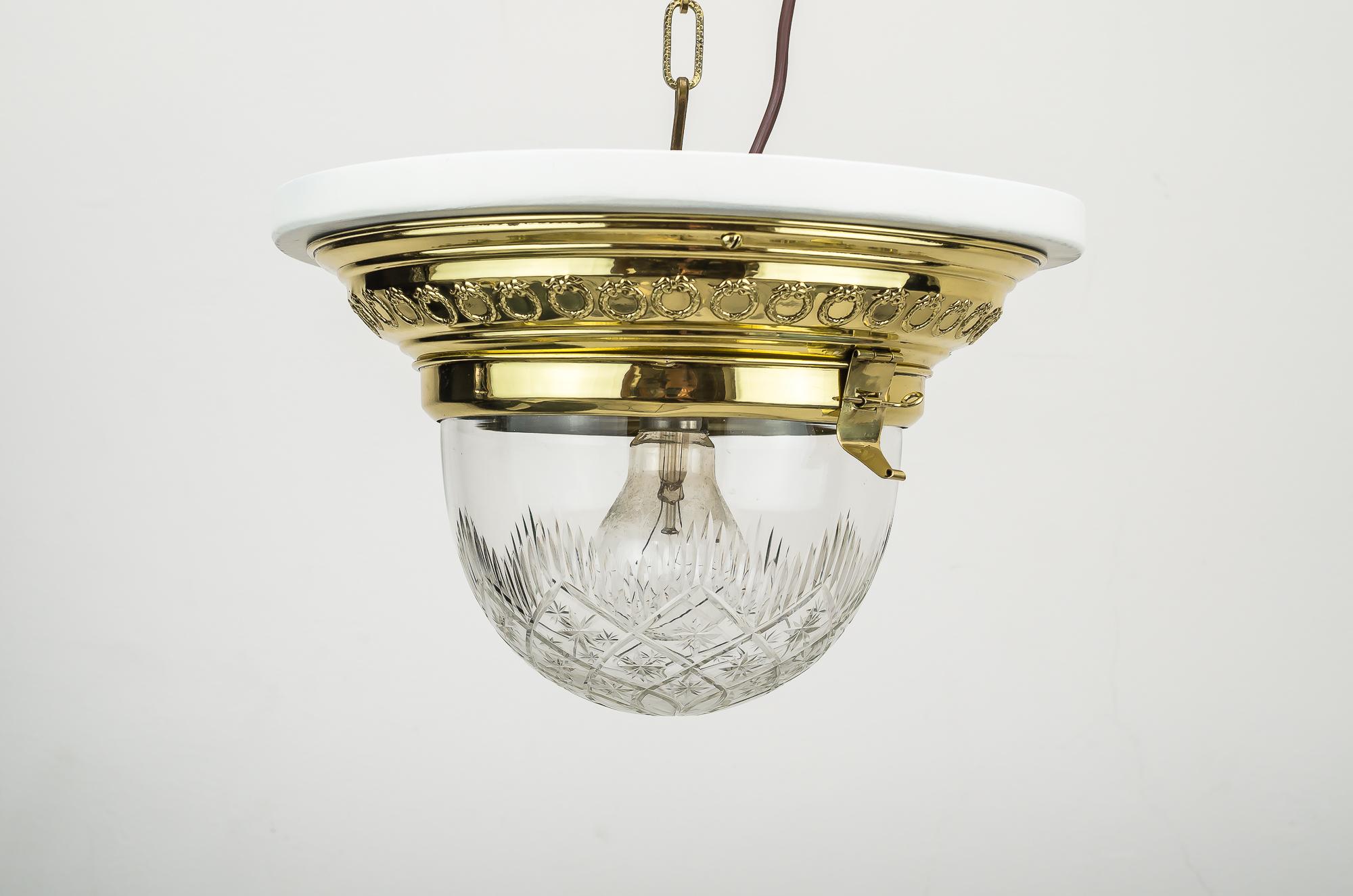Jugendstil ceiling lamp 1906 with original glass and painted wood plate.
Polished and stove enameled.