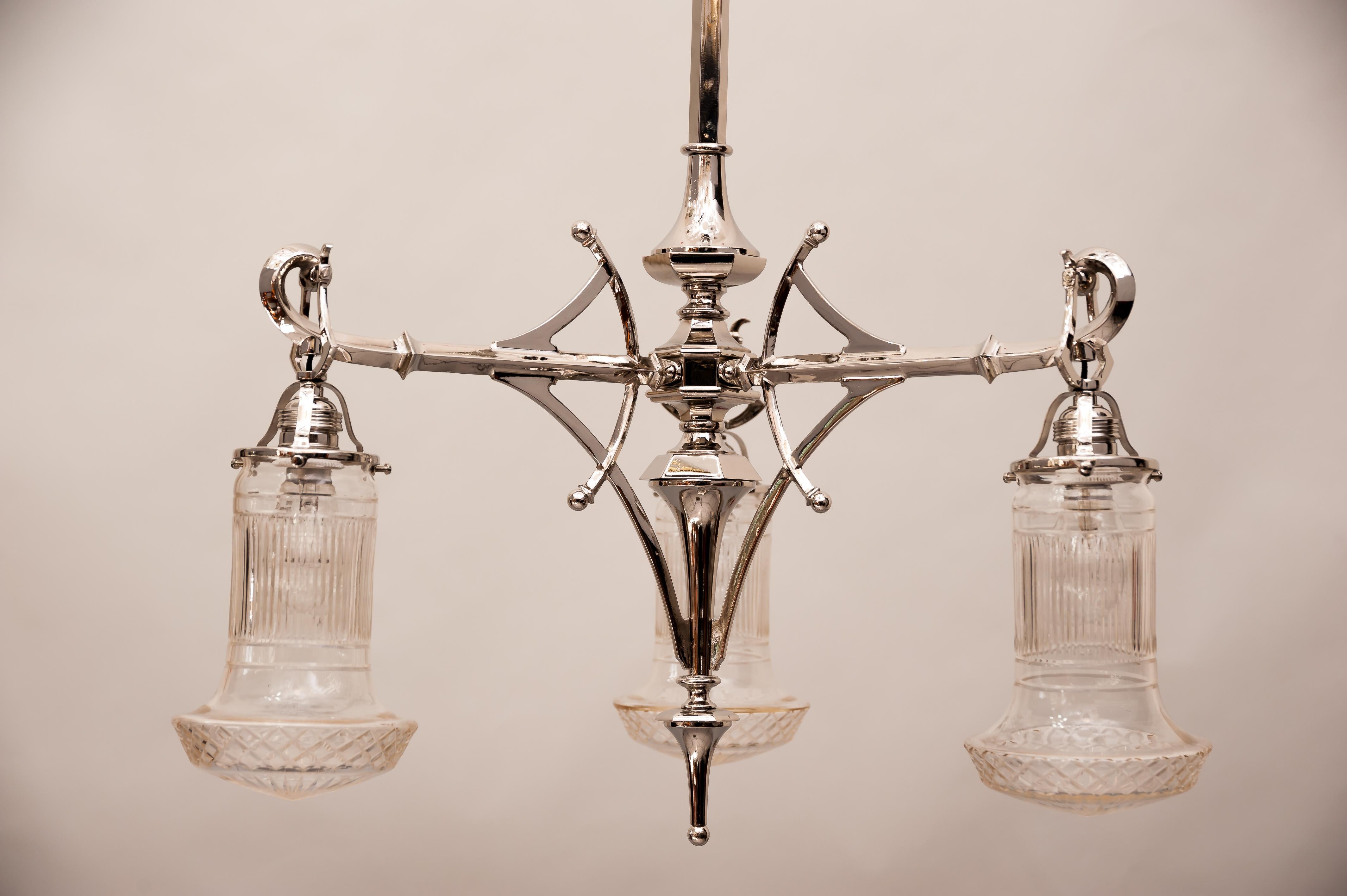 Jugendstil chandelier nickel plated circa 1910s with original glasses.
New wired
New nickel-plated.