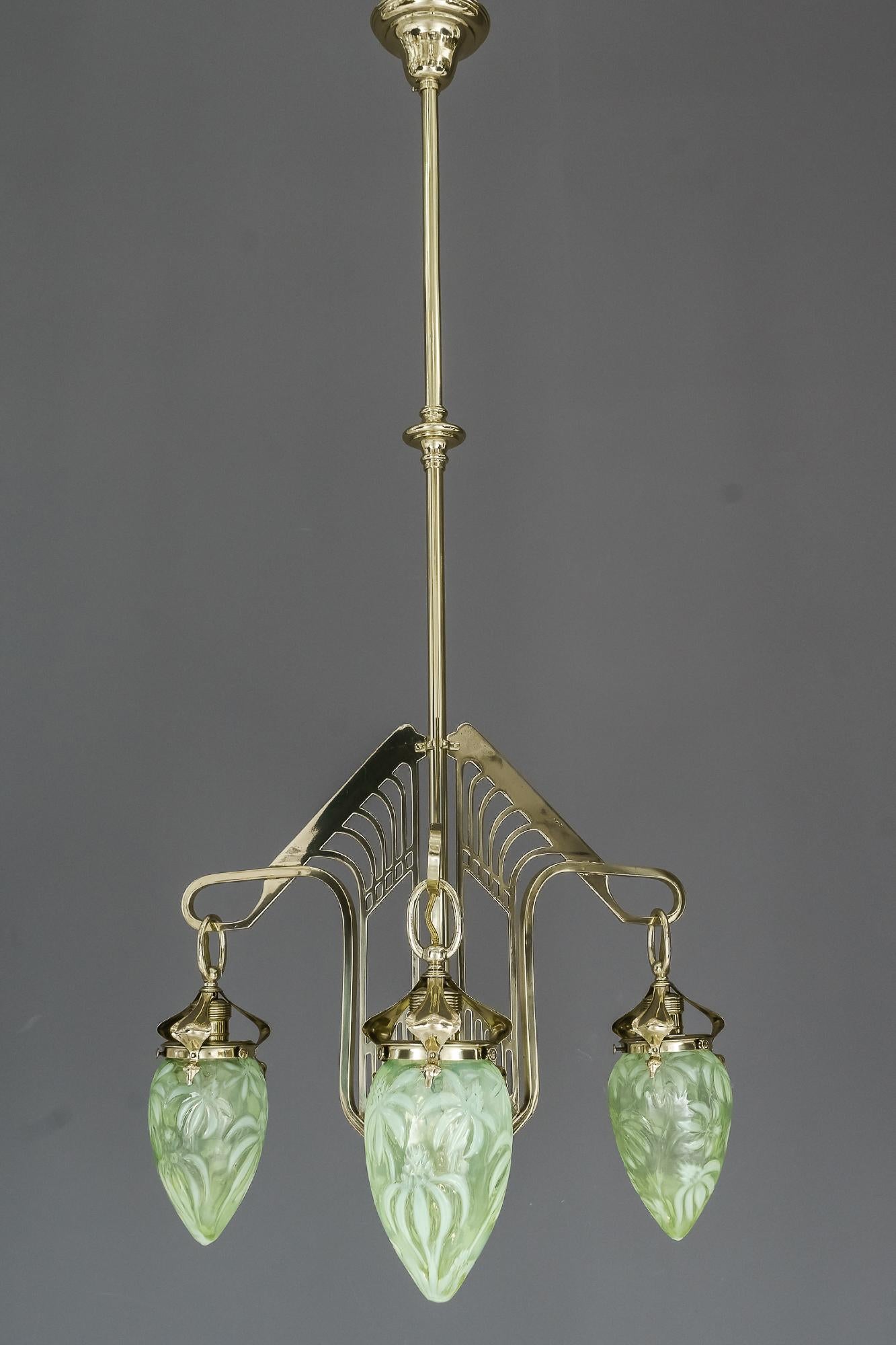 Jugendstil chandelier Vienna, circa 1908 with original opaline glass shades
Polished and stove enameled.