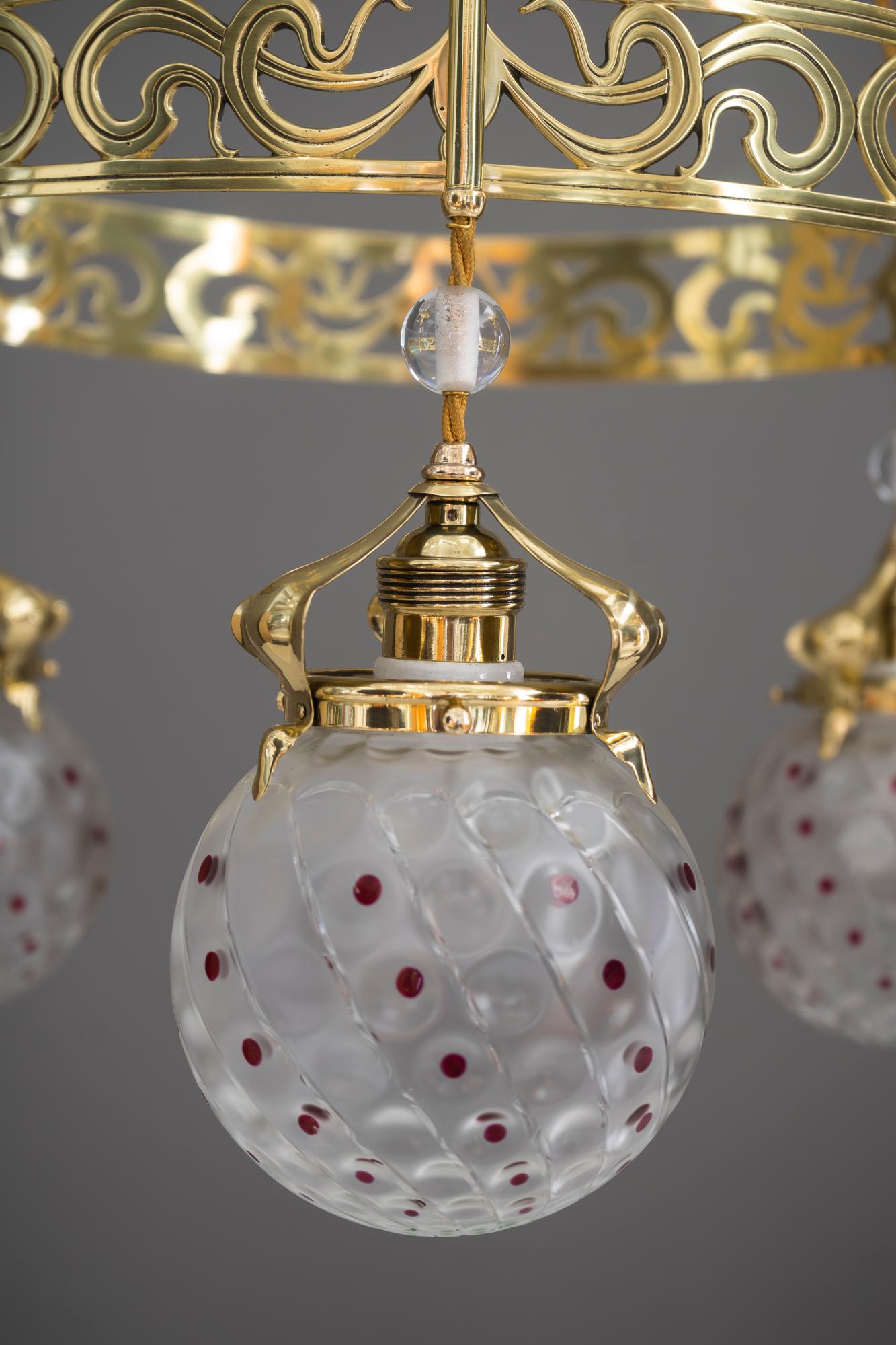 Jugendstil chandelier, Vienna, circa 1909
Brass polished and stove enamelled
Original antique glass shades ( partly painted ).