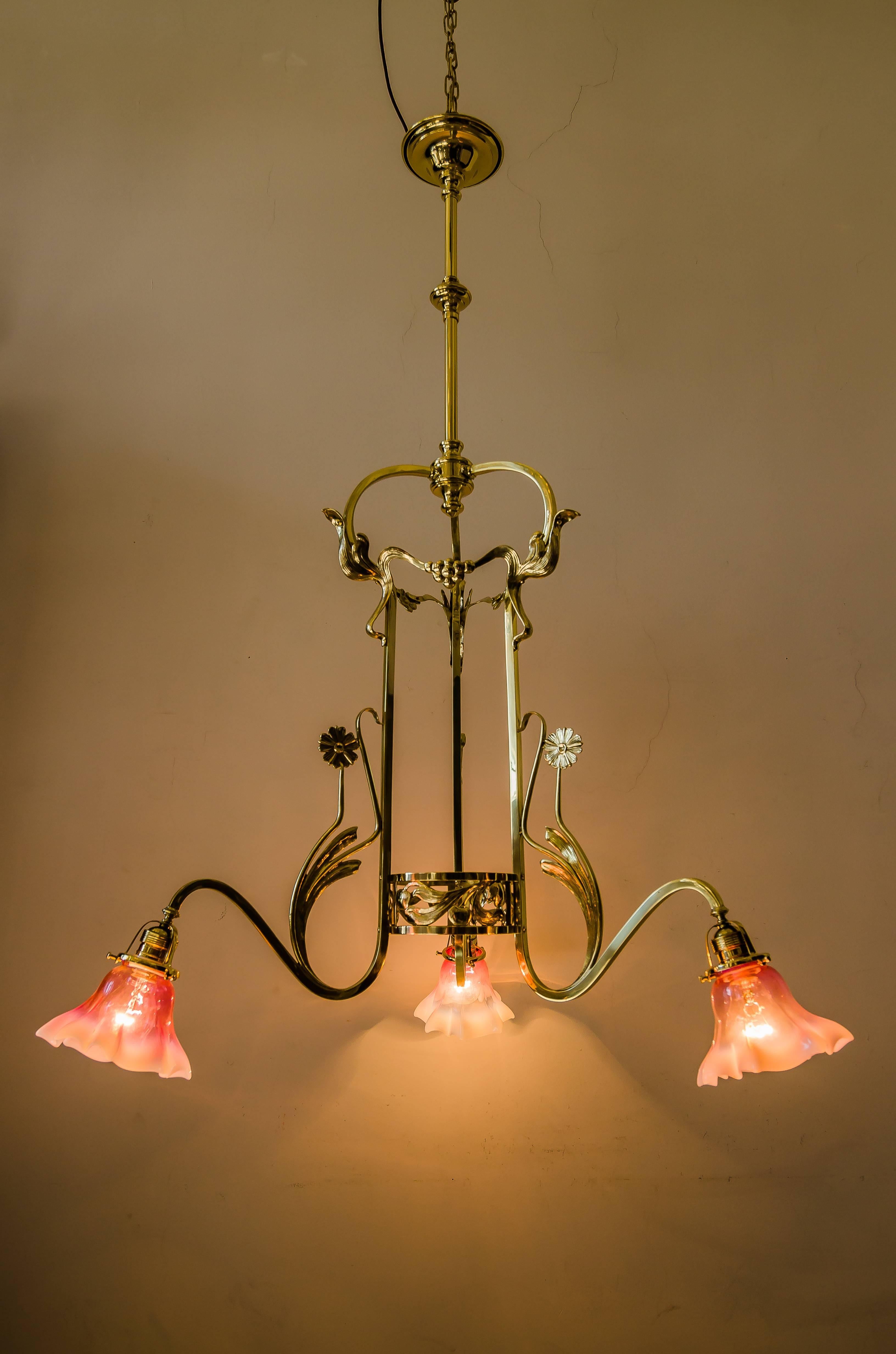Jugendstil chandelier with opaline glass shades
polished and stove enameled.