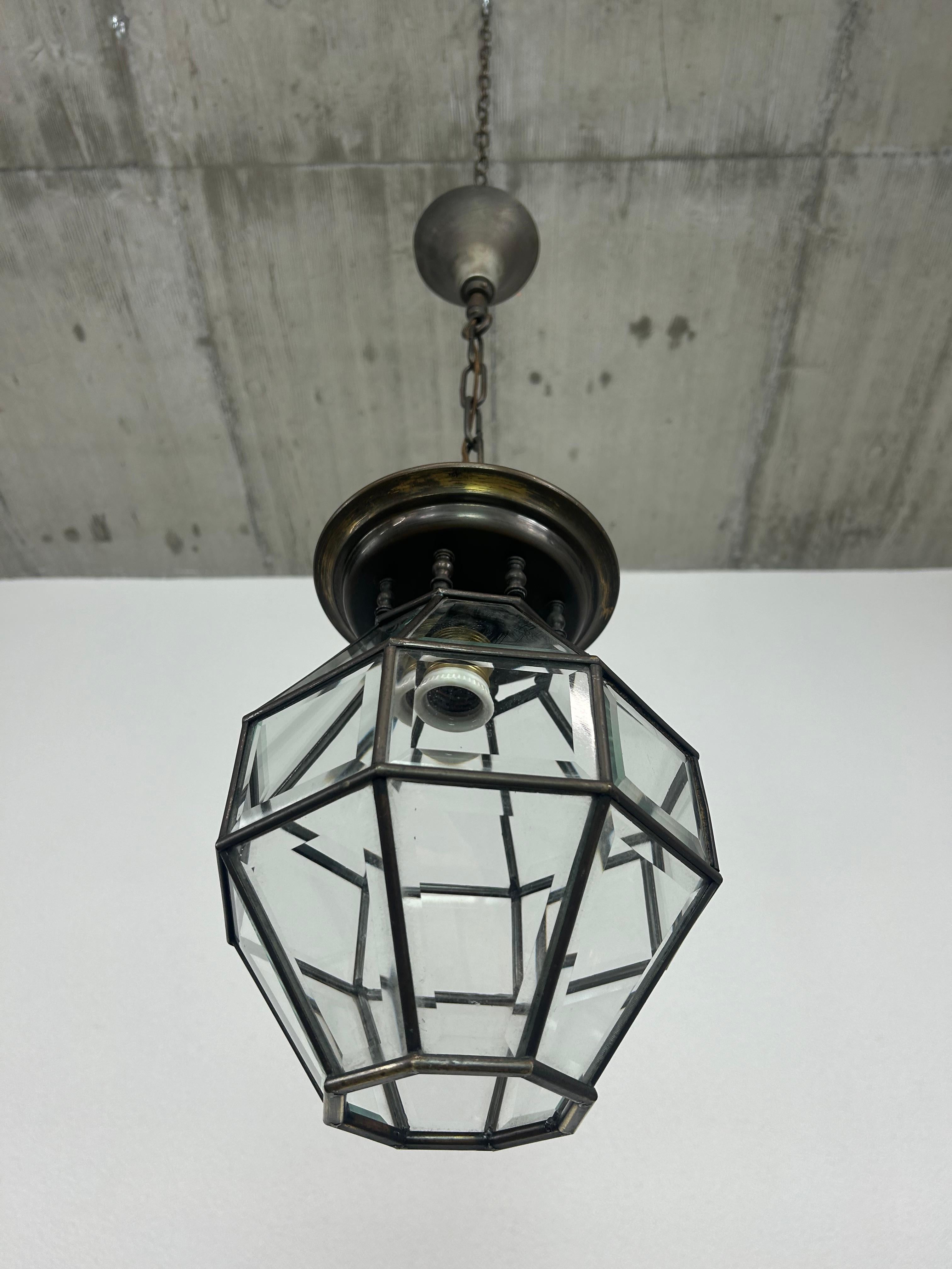 Lamp in cubic shape with cutted glass and bronze connections designed by Adolf Loos circa 1915. 