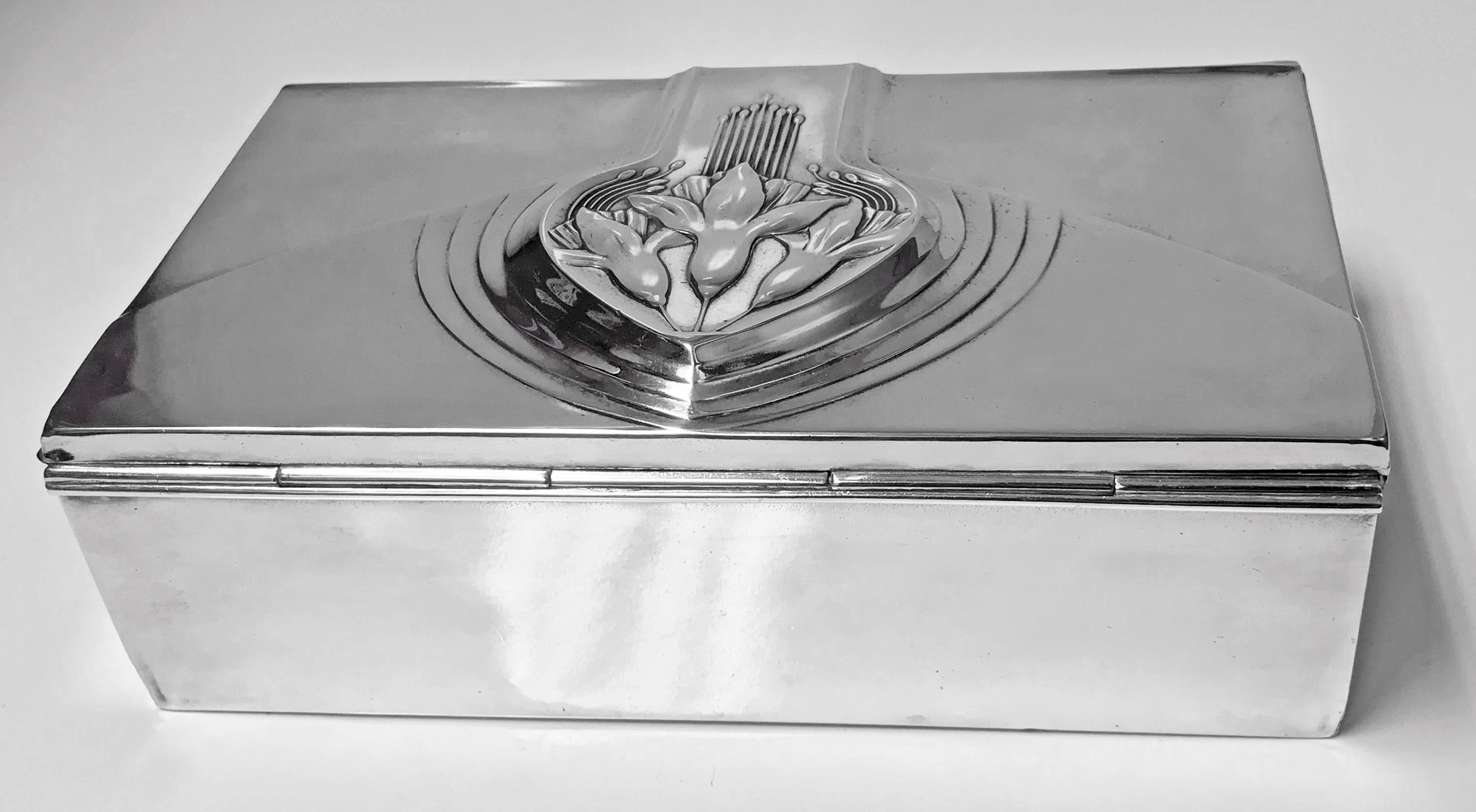Jugendstil Nouveau secessionist silver plate jewelry box, WMF, Germany, circa 1906. The large rectangular box with stylized raised foliate hinged cover, plain sides. Satin silk lined interior. WMF marks on underside. Measures: 8.75 x 5.50 x 2.50