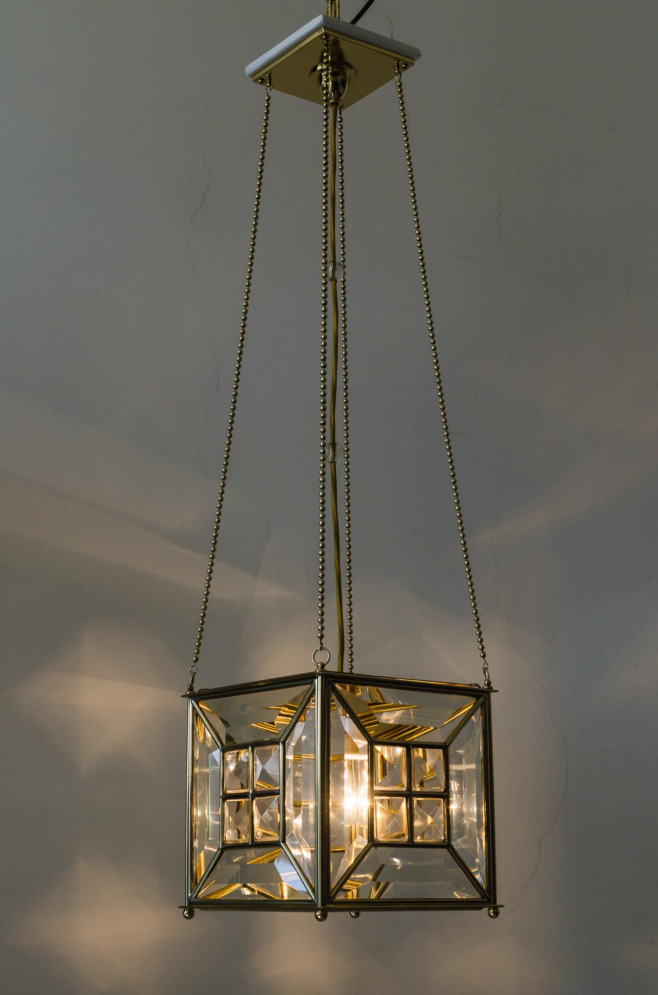 An amazing execution of an Jugendstil pendant.
Original cut-glass.
White painted wood plate on the top.
Two small glass balls on the middle wire (see last picture)
Brass polished and stove enameled.