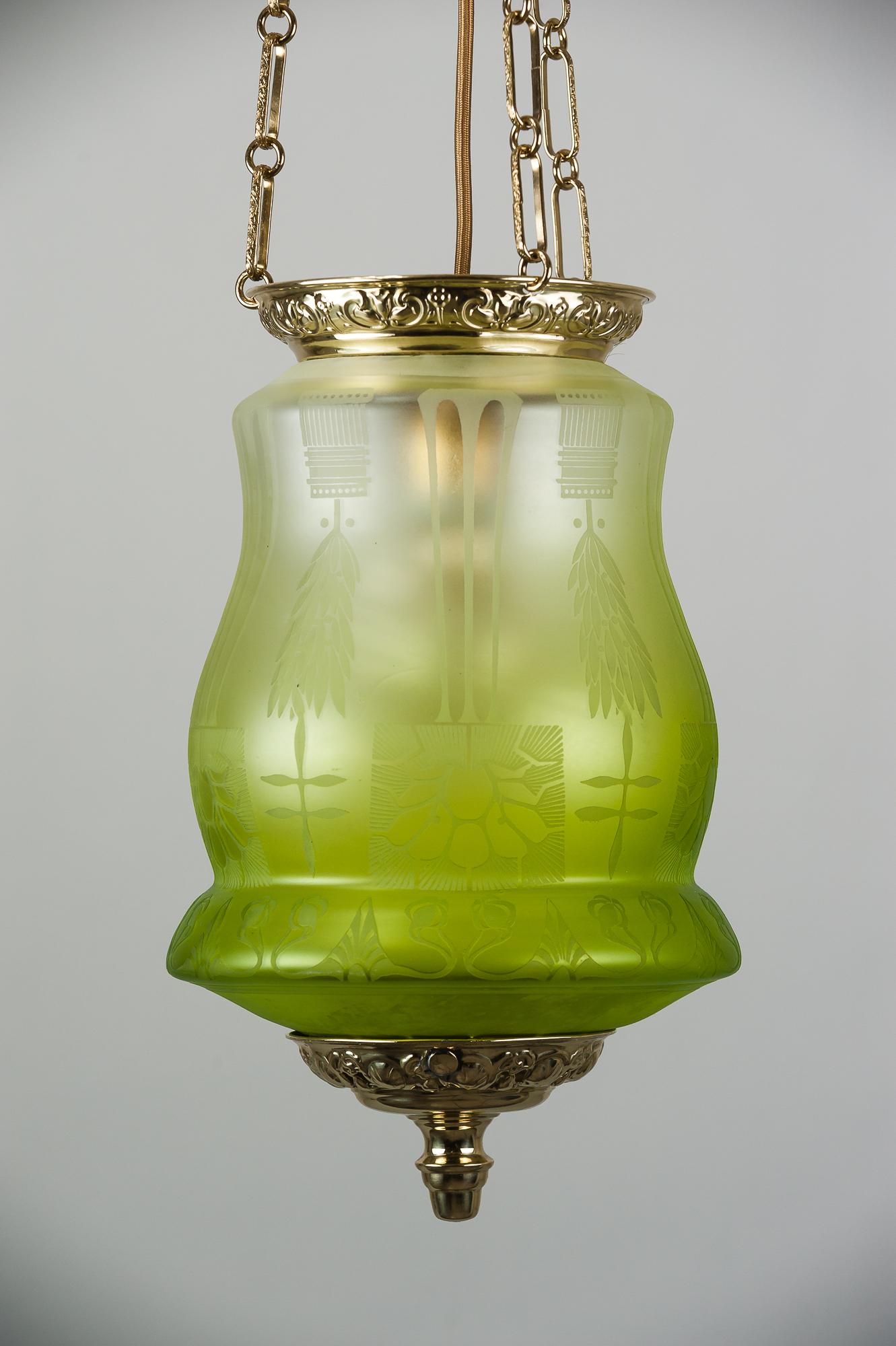 Jugendstil pendant circa 1900s with original glass.
Brass polished and stove enameled.
 