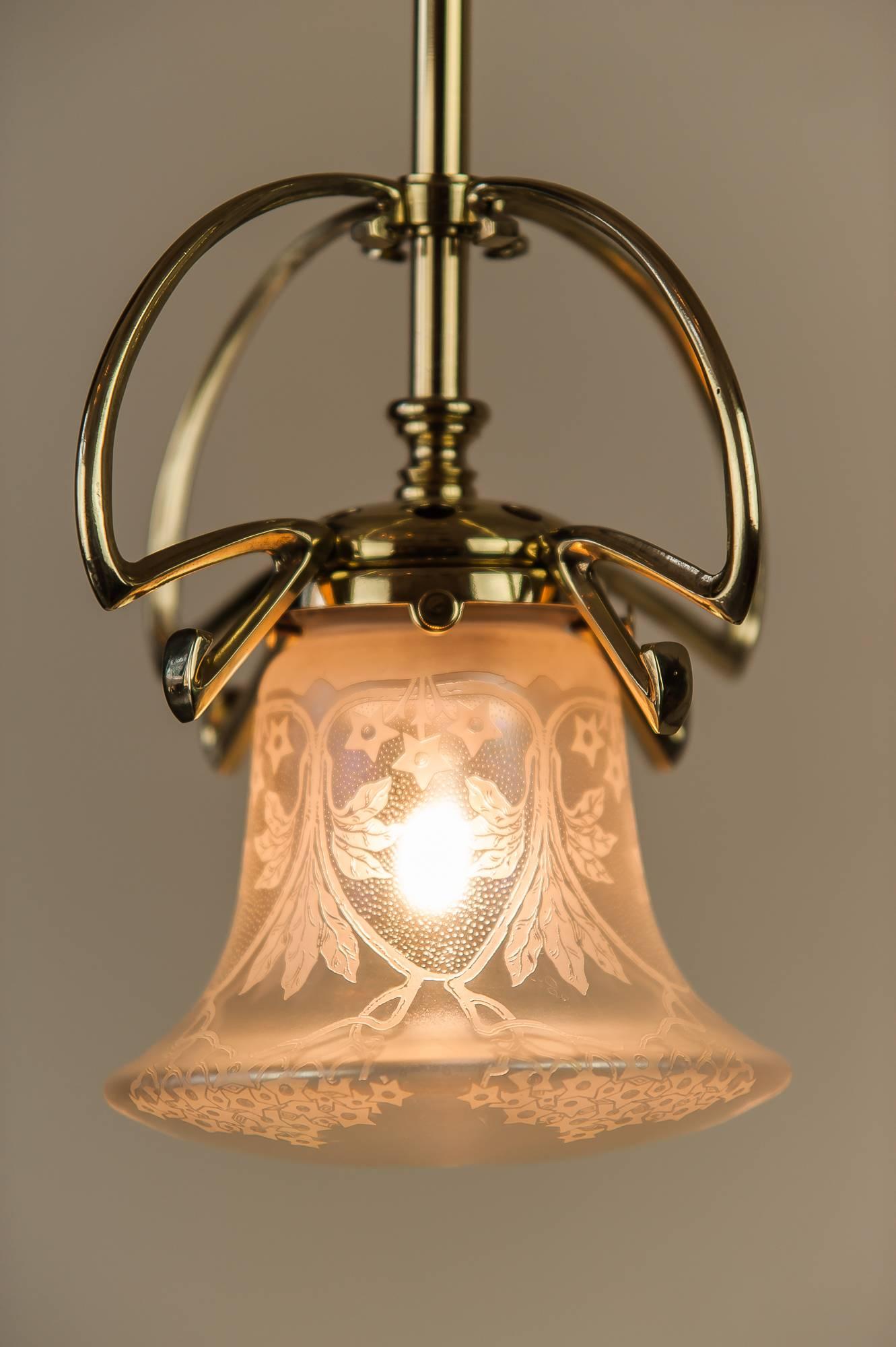 Jugendstil pendant circa 1908 with original glass shade
Polished and stove enamelled.
    