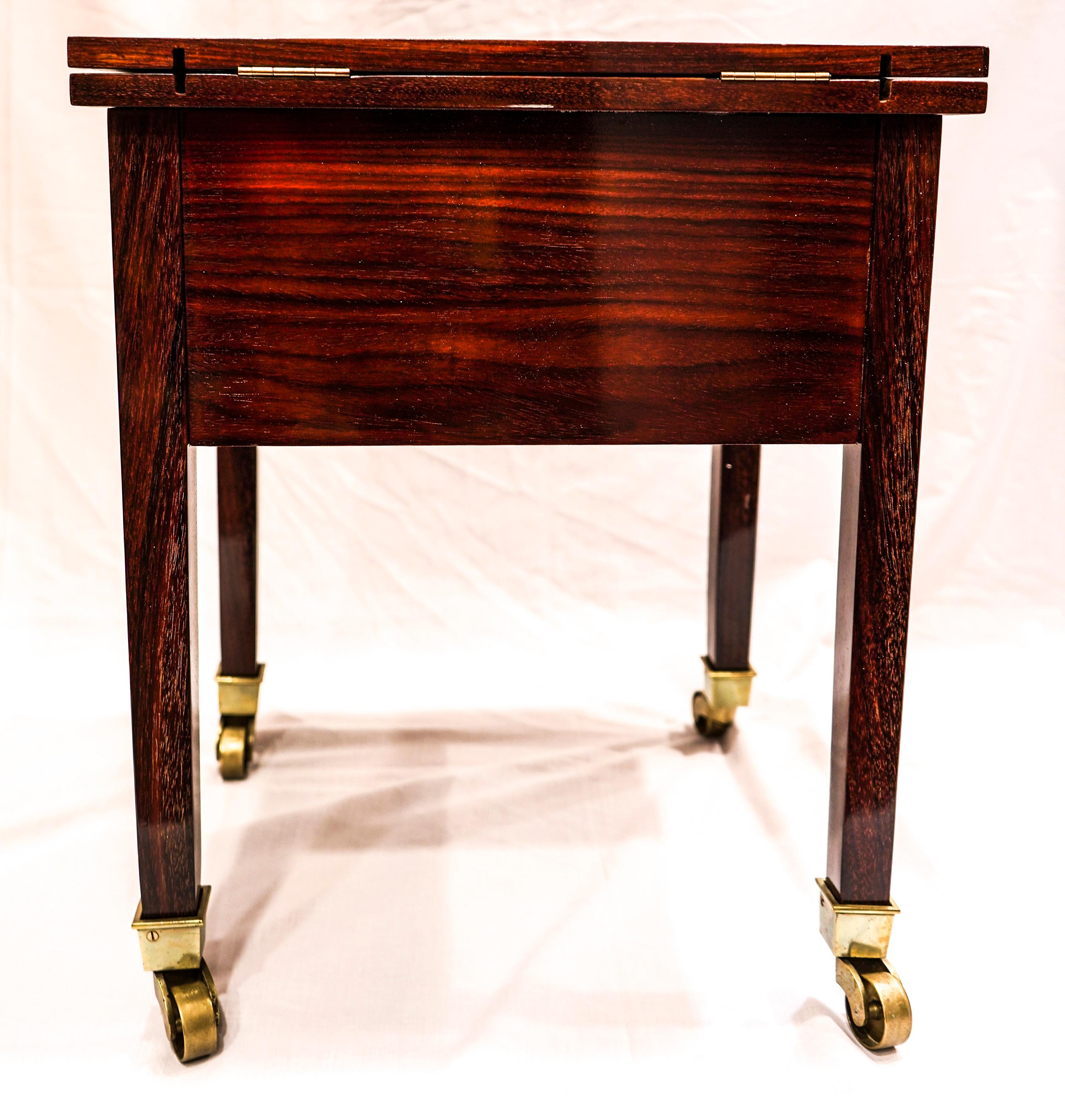 Exquisite and stunning piece for collector, is a bar cart by Portois & Fix, Wien, one of the best manufacturers of the Austrian modernism or Jugendstil, architects as Hoffman or Otto Wagner worked with them.
Is a bar cart in mahogany with golded