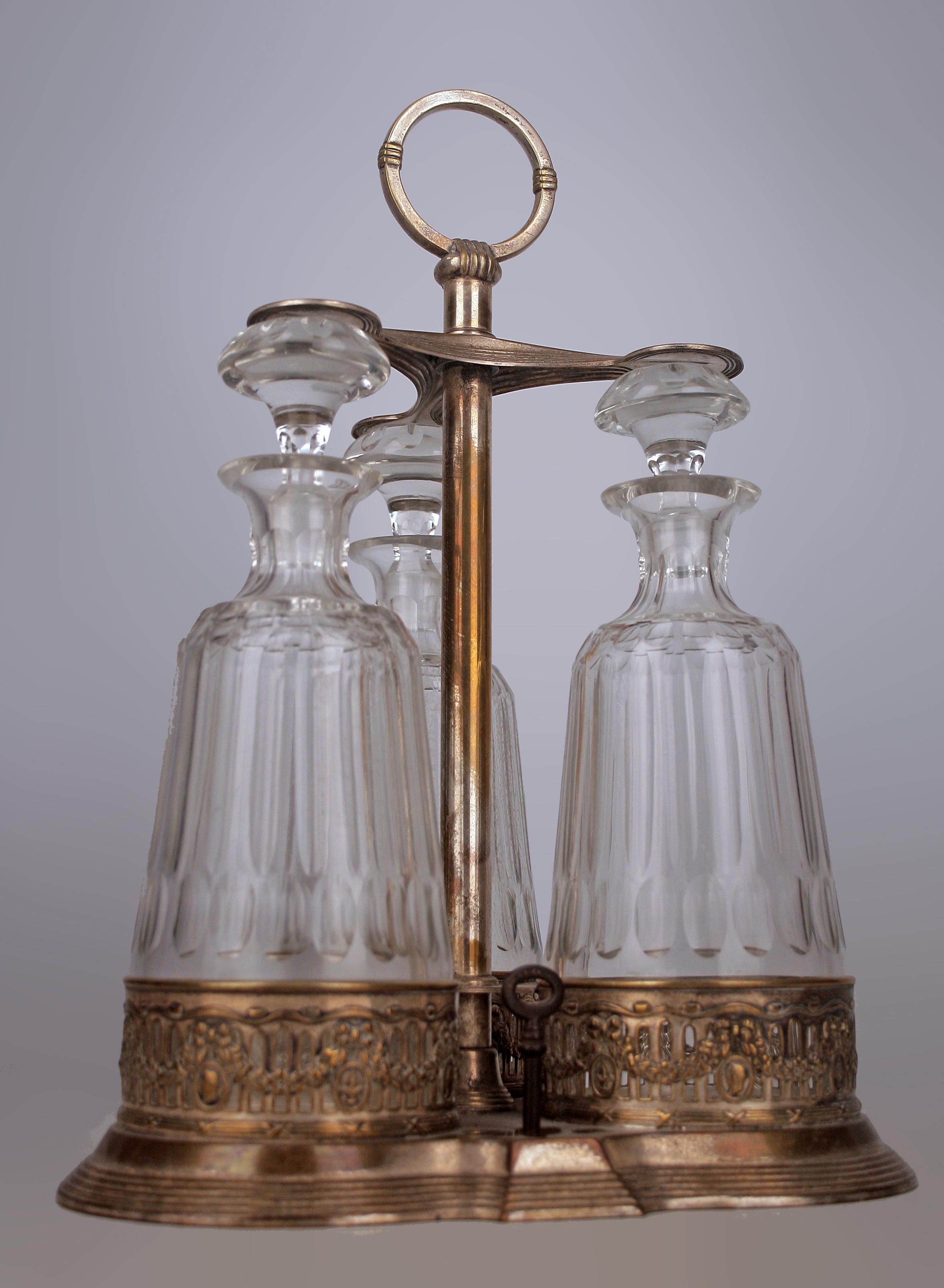 Jugendstil/Art Nouveau Set of Silver Tantalus and Three Glass Decanters with Stoppers by german company Württembergische Metallwarenfabrik (WMF)

By: Württembergische Metallwarenfabrik (WMF)
Material: silver, glass, cut glass, metal, crystal,