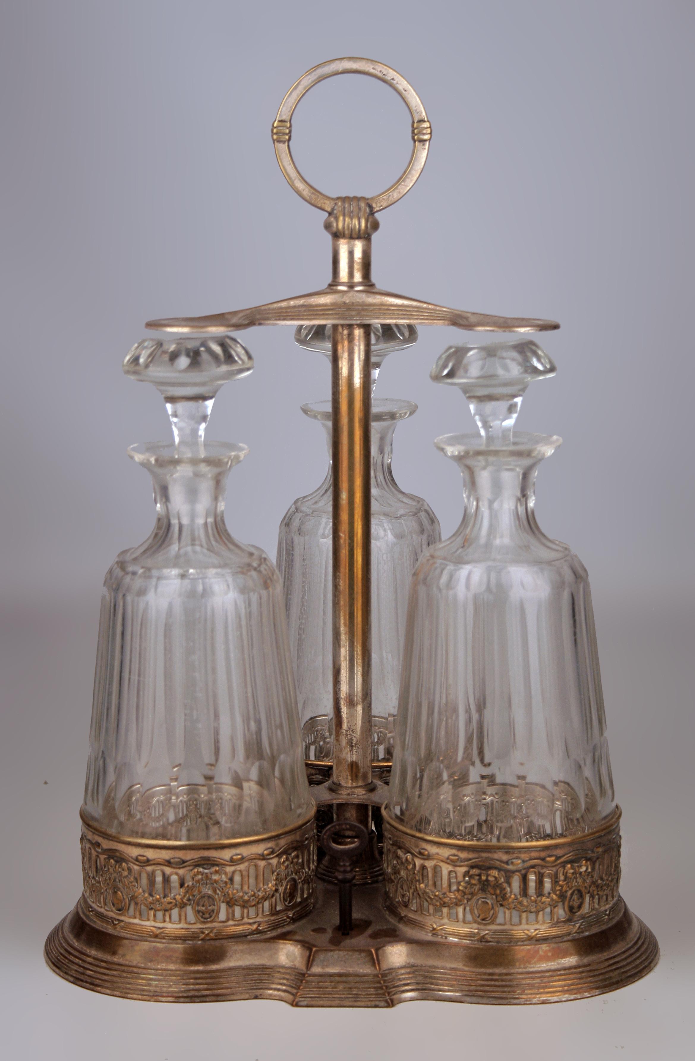 German Jugendstil Set of Silver Tantalus and Three Glass Decanters with Stoppers by WMF For Sale